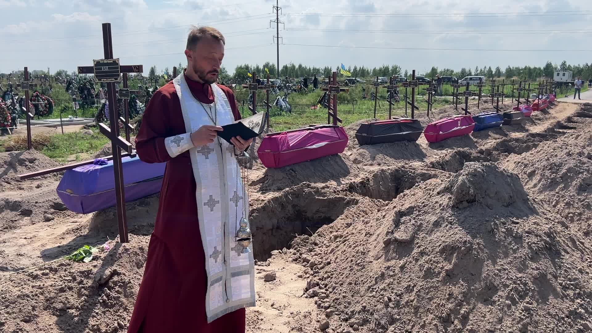 Mass burial of unidentified people killed during Russian invasion in Bucha 