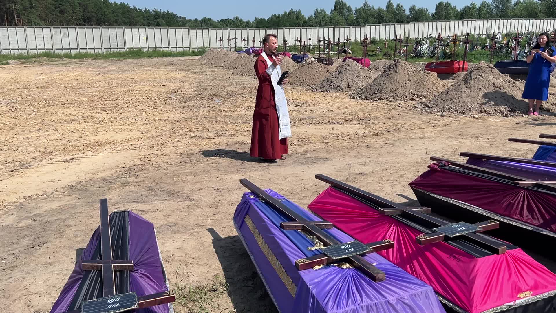 Mass burial of unidentified people killed during Russian invasion in Bucha 