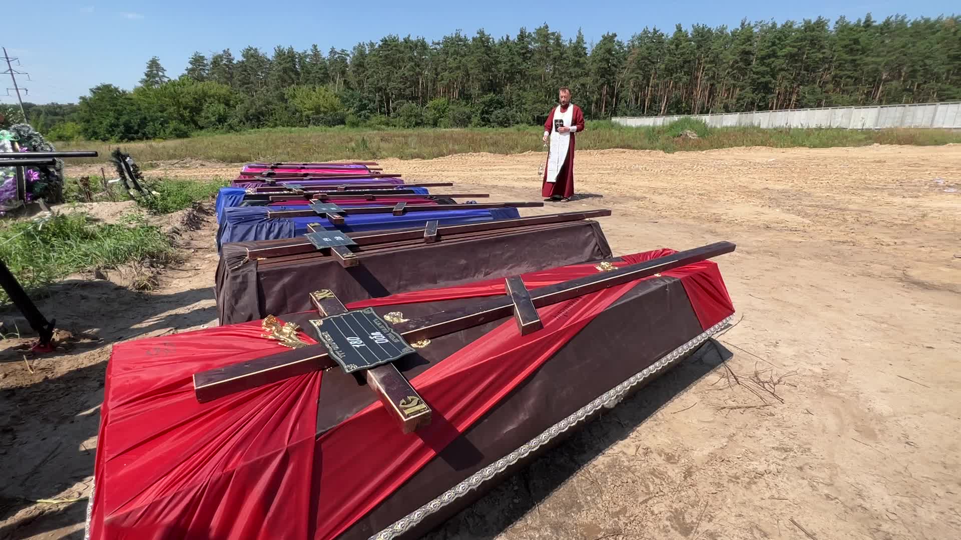 Mass burial of unidentified people killed during Russian invasion in Bucha 
