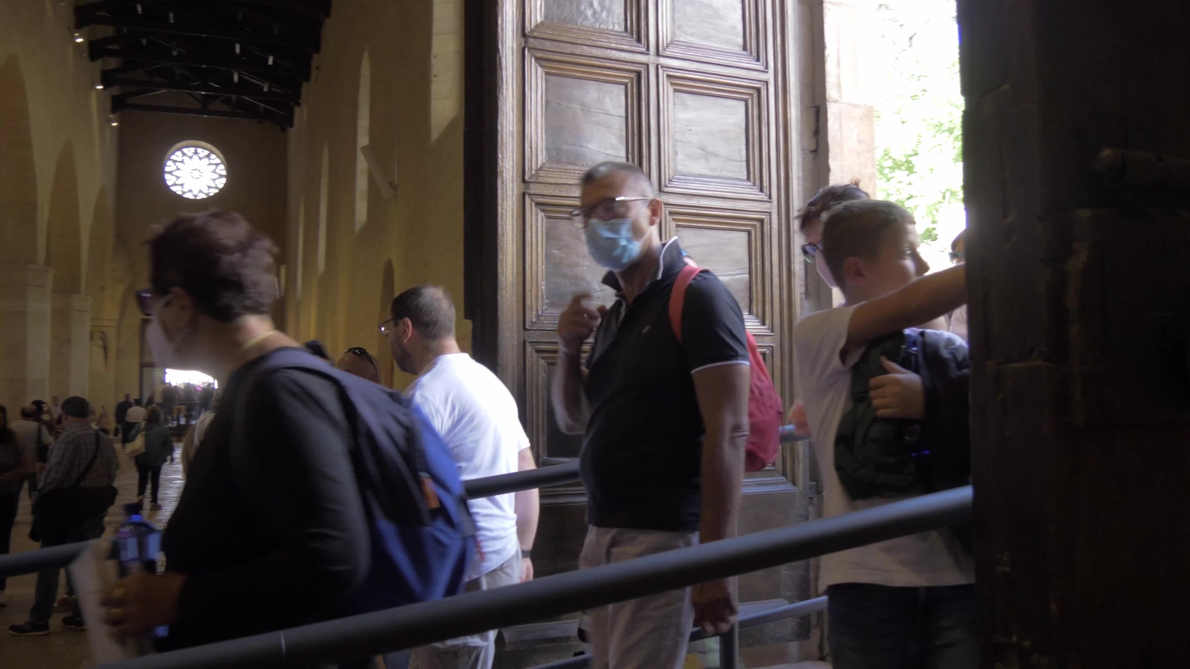 People Enter The Holy Door In L'Aquila, Italy
