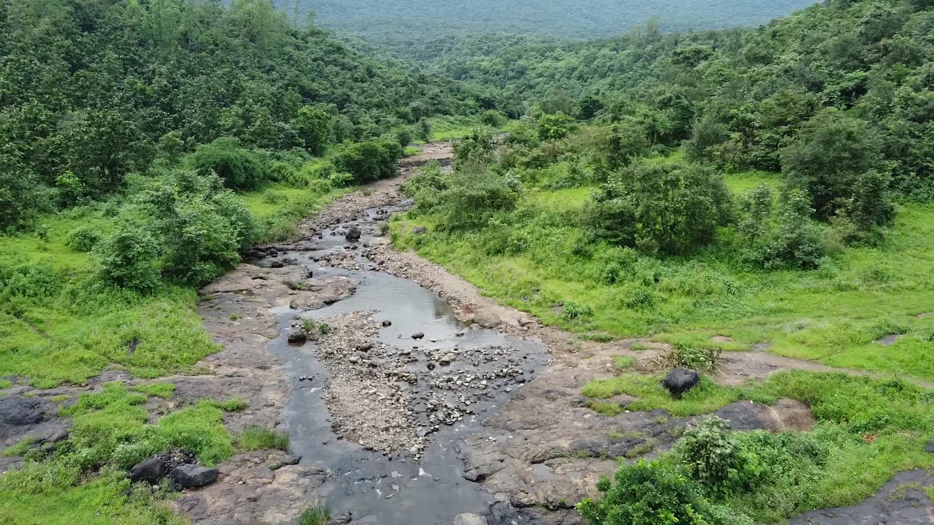 Group of friends enjoying the nature and waterfall