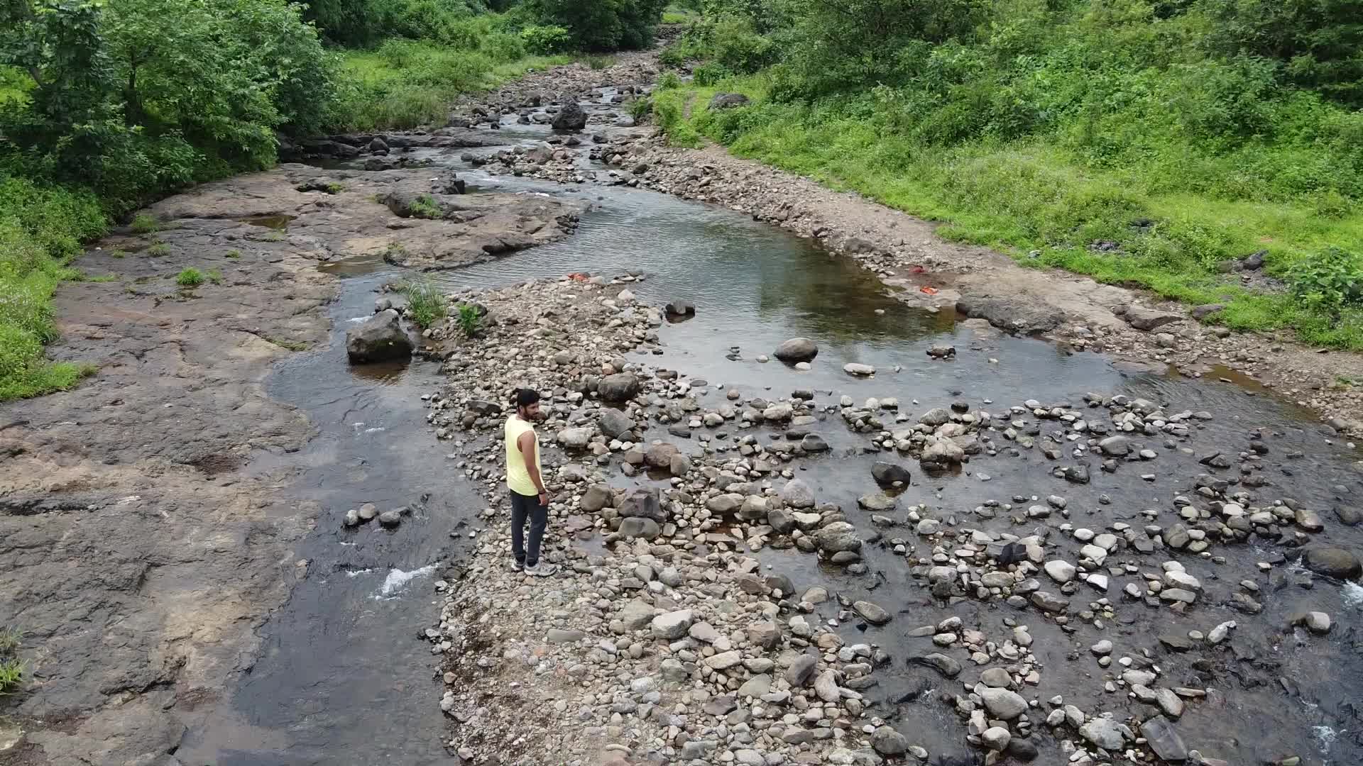 Group of friends enjoying the nature and waterfall