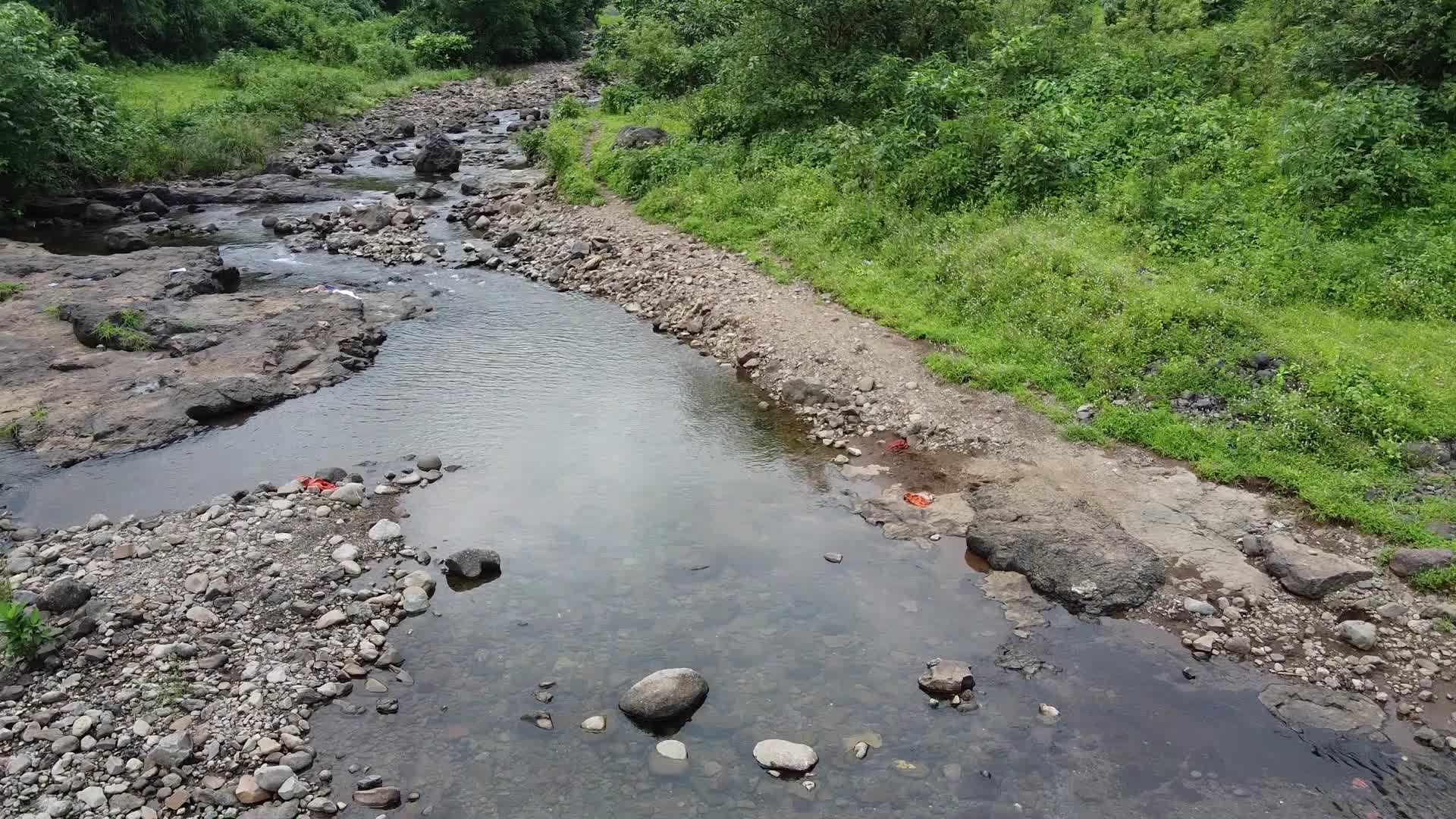 Group of friends enjoying the nature and waterfall
