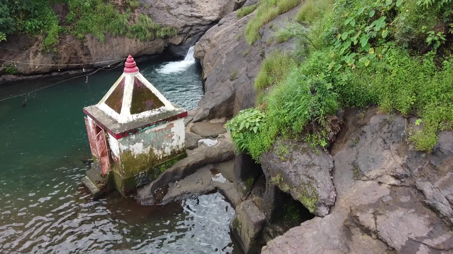 Group of friends enjoying the nature and waterfall