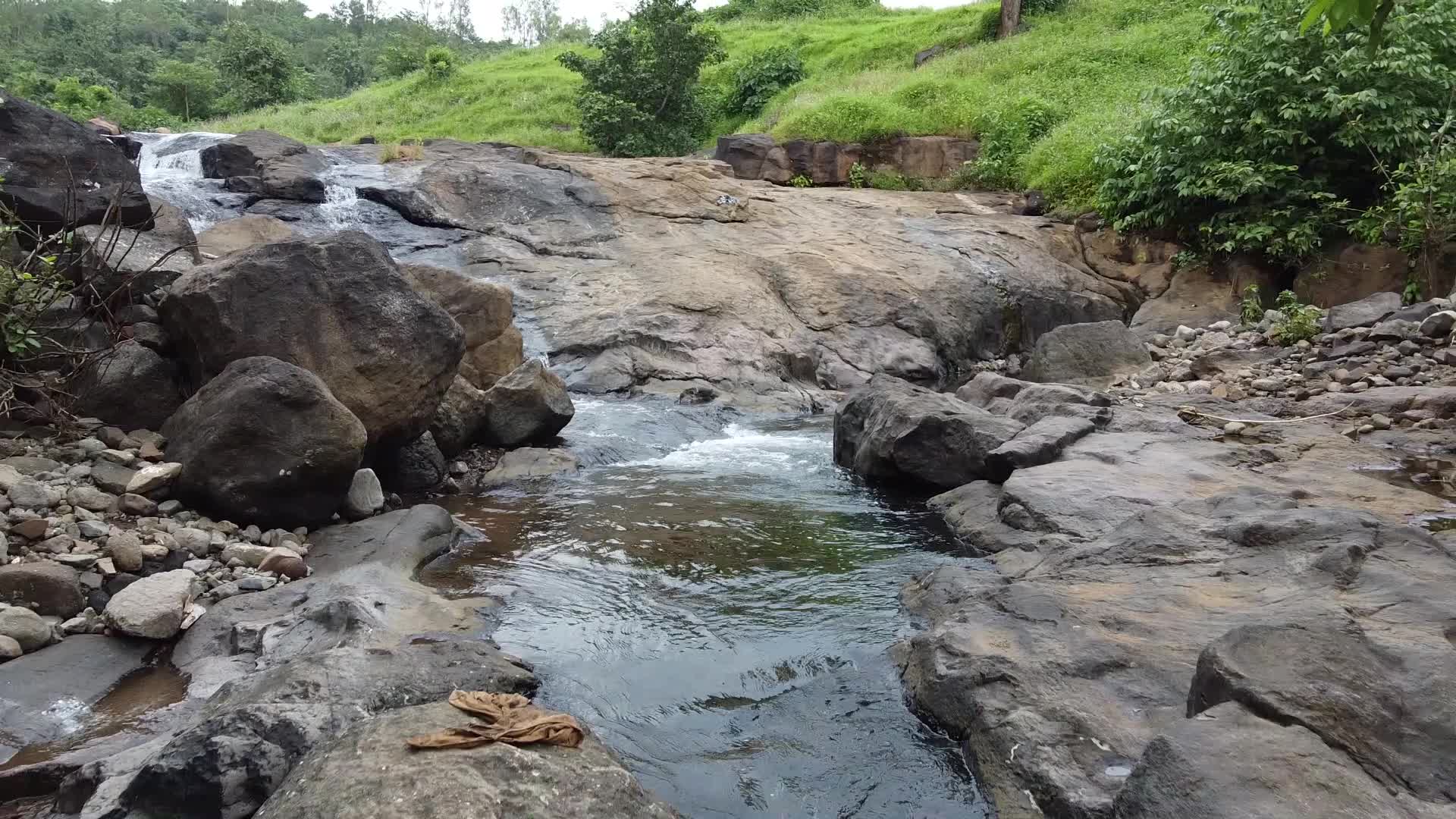 Group of friends enjoying the nature and waterfall