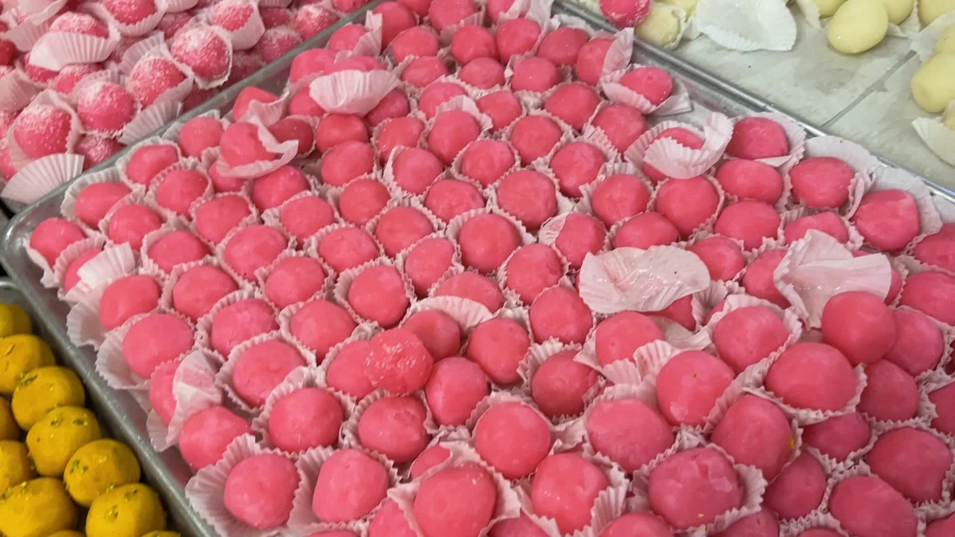 People purchase Indian sweets for the festival of Diwali 