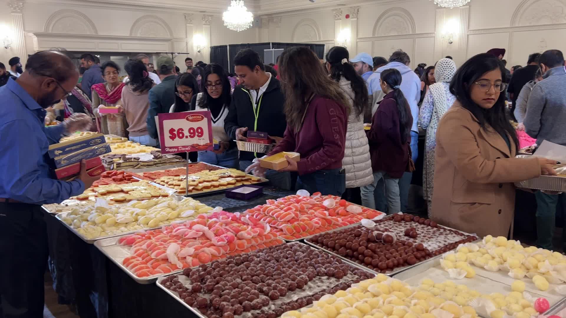People purchase Indian sweets for the festival of Diwali 