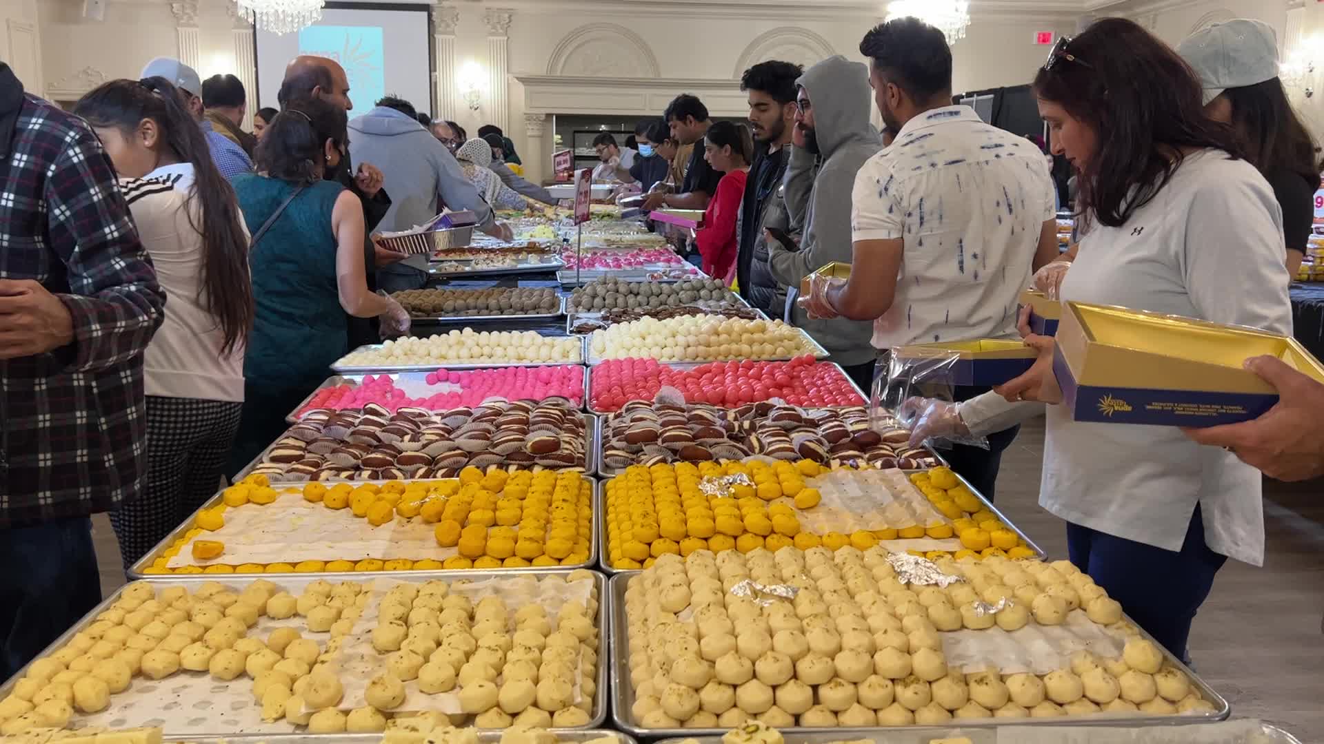 People purchase Indian sweets for the festival of Diwali 