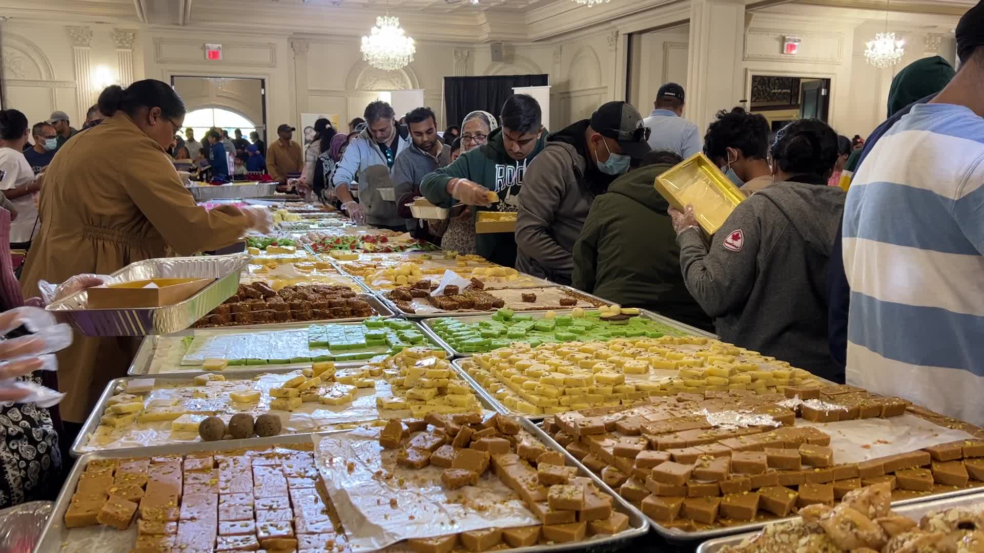 People purchase Indian sweets for the festival of Diwali 