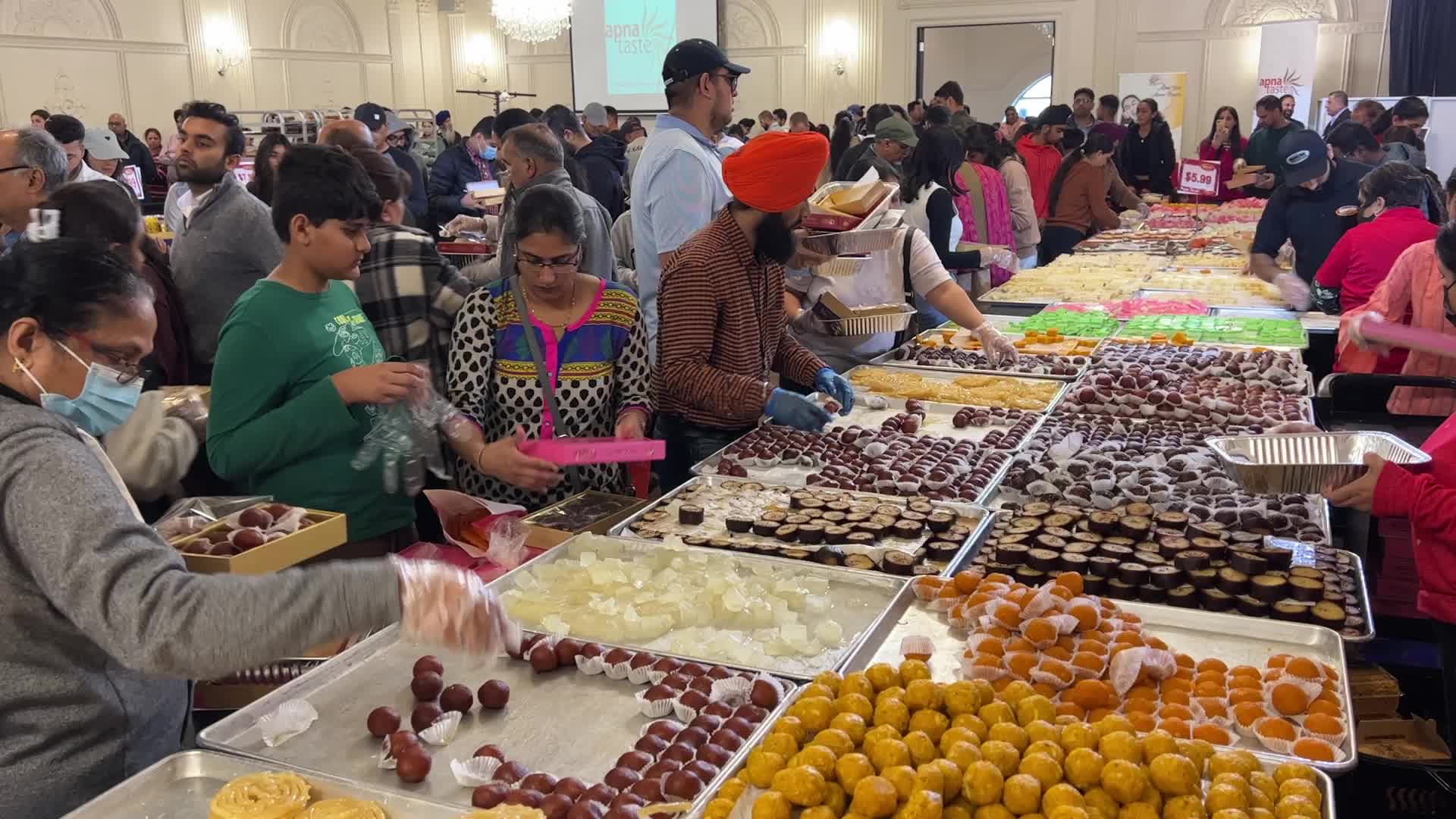 People purchase Indian sweets for the festival of Diwali 