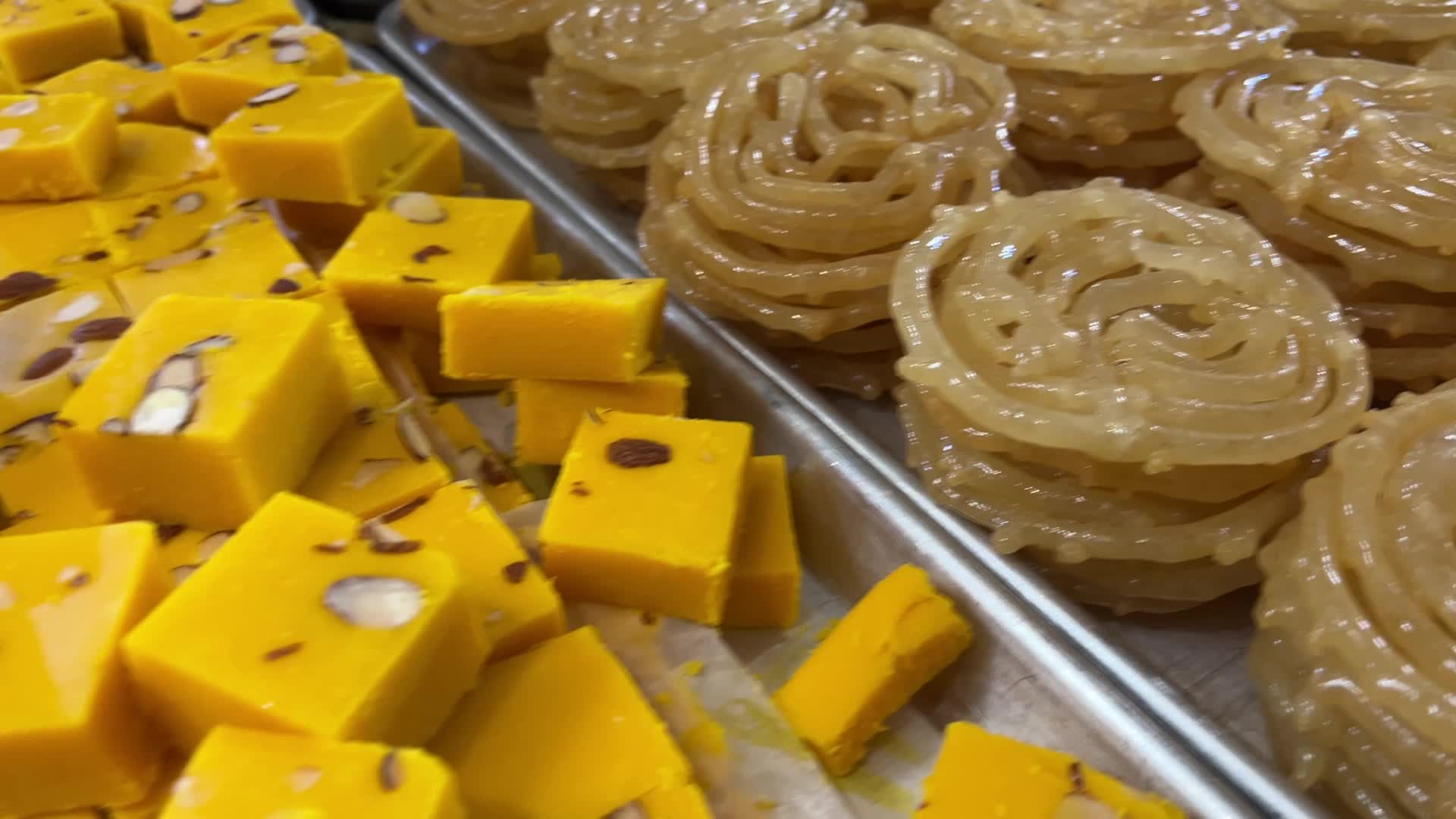 People purchase Indian sweets for the festival of Diwali 