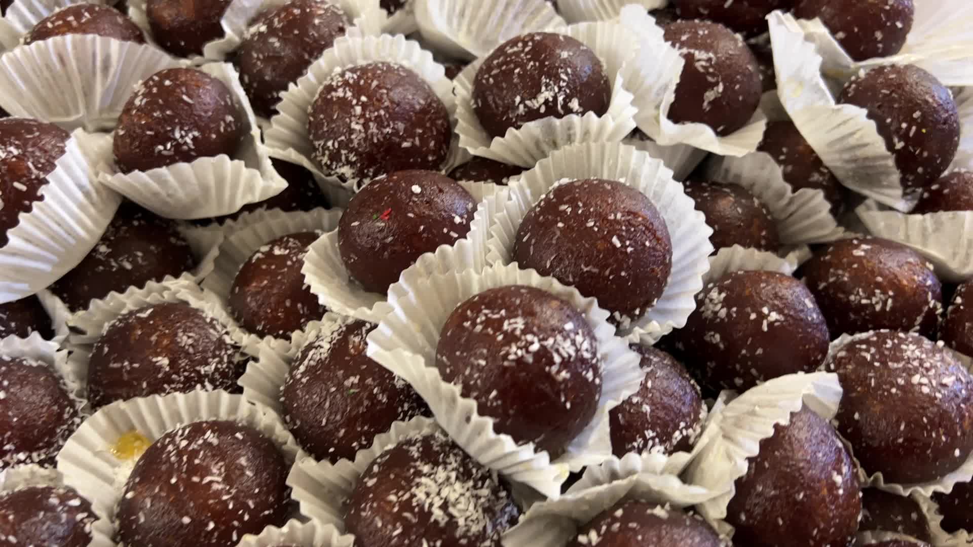 People purchase Indian sweets for the festival of Diwali 