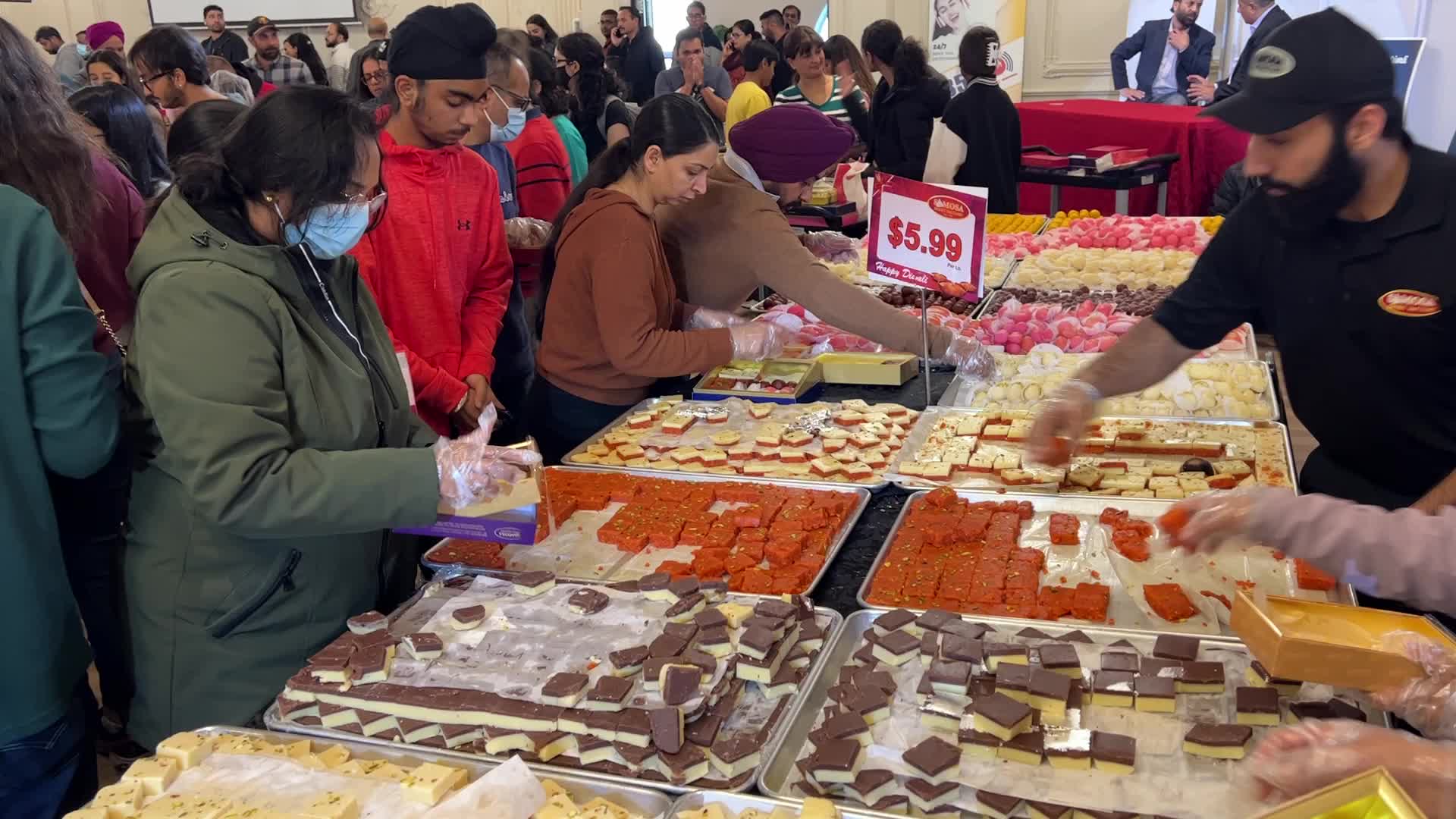 People purchase Indian sweets for the festival of Diwali 