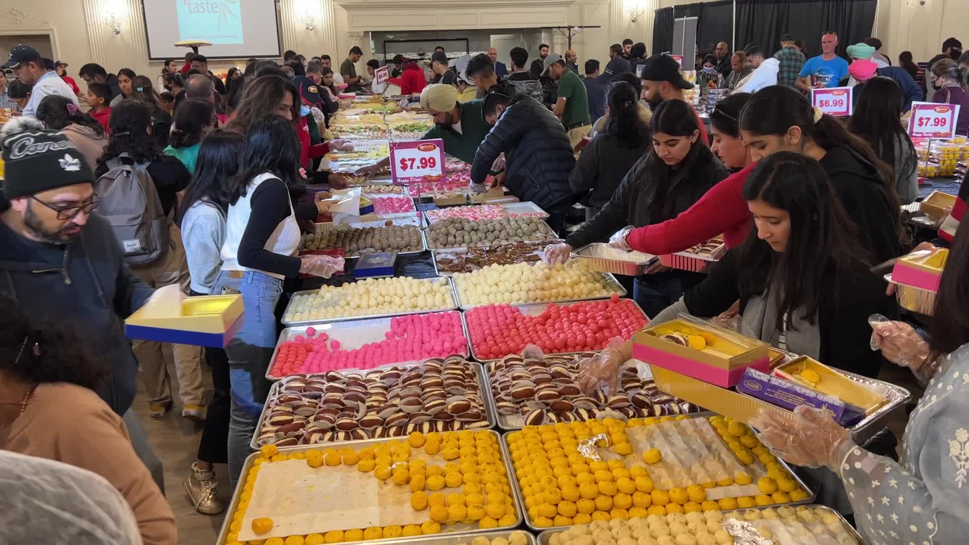 People purchase Indian sweets for the festival of Diwali 