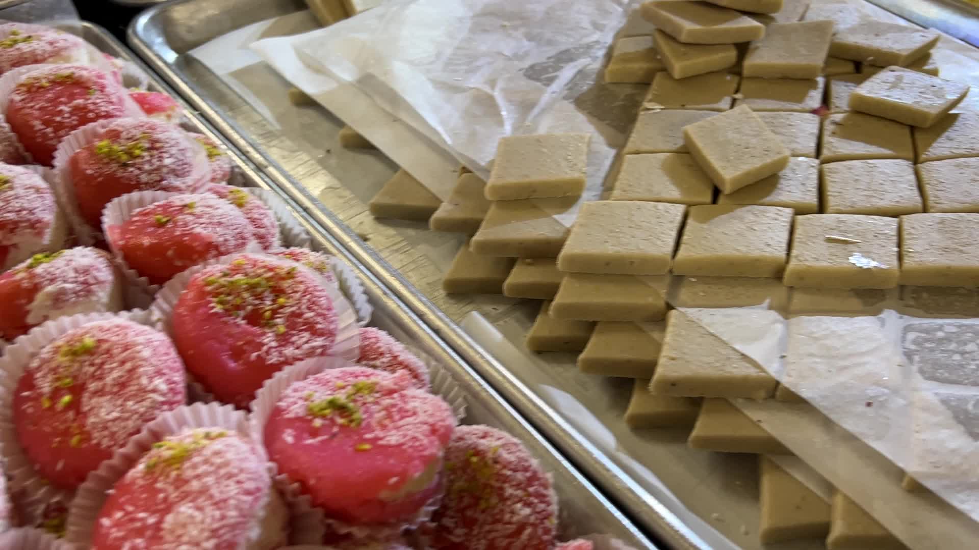 People purchase Indian sweets for the festival of Diwali 