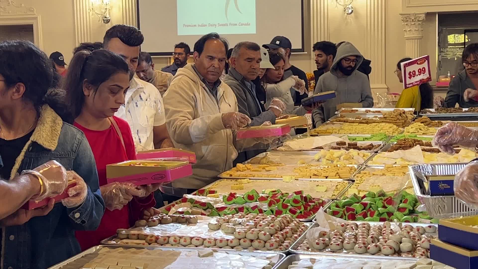 People purchase Indian sweets for the festival of Diwali 