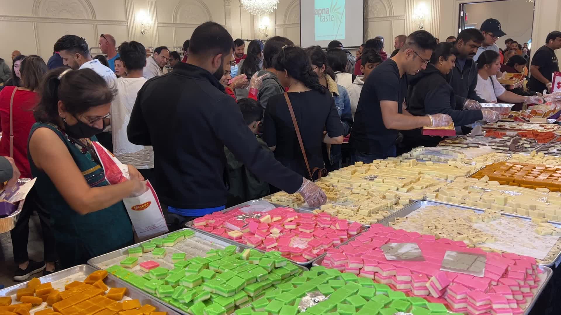 People purchase Indian sweets for the festival of Diwali 