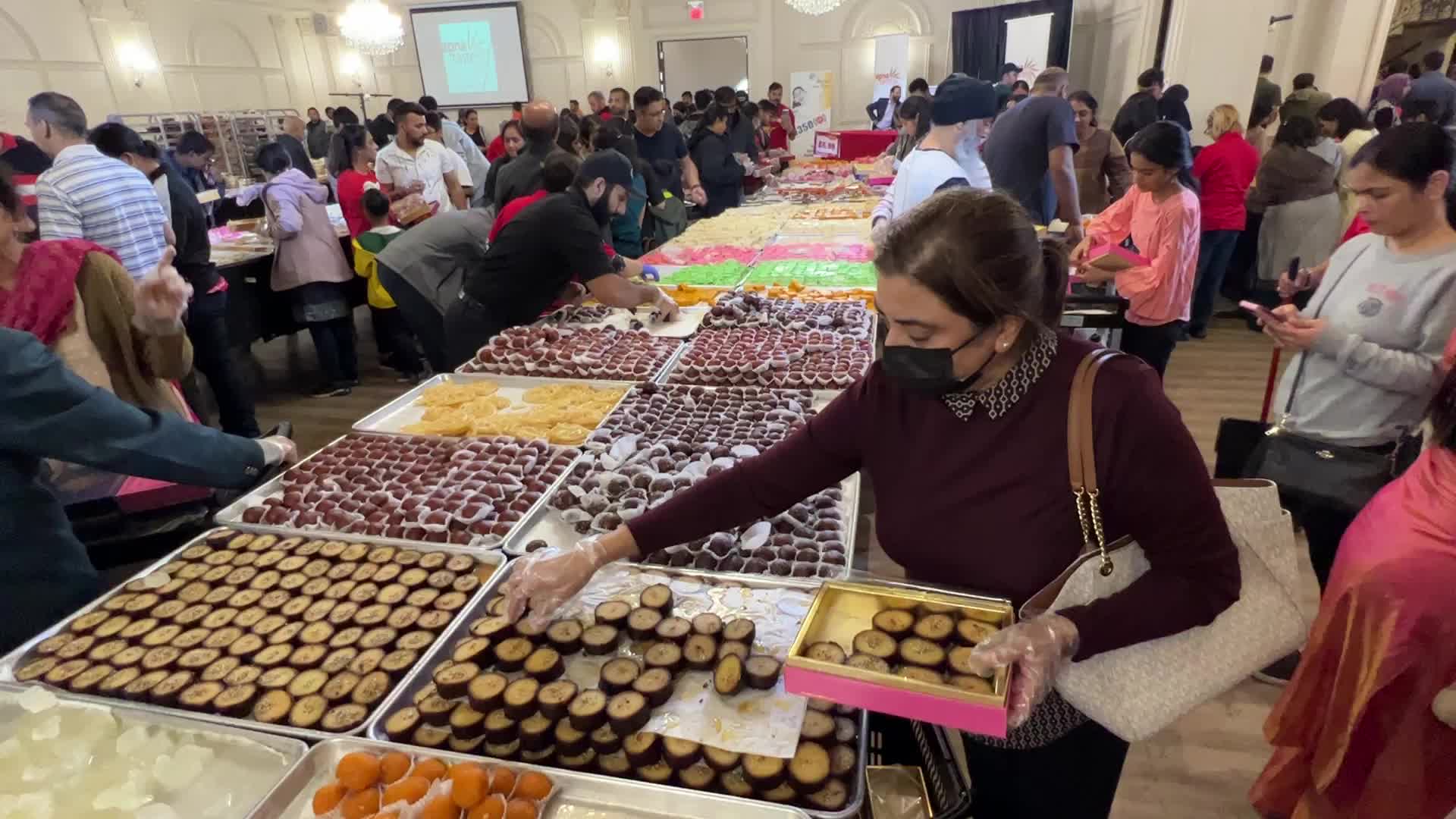 People purchase Indian sweets for the festival of Diwali 