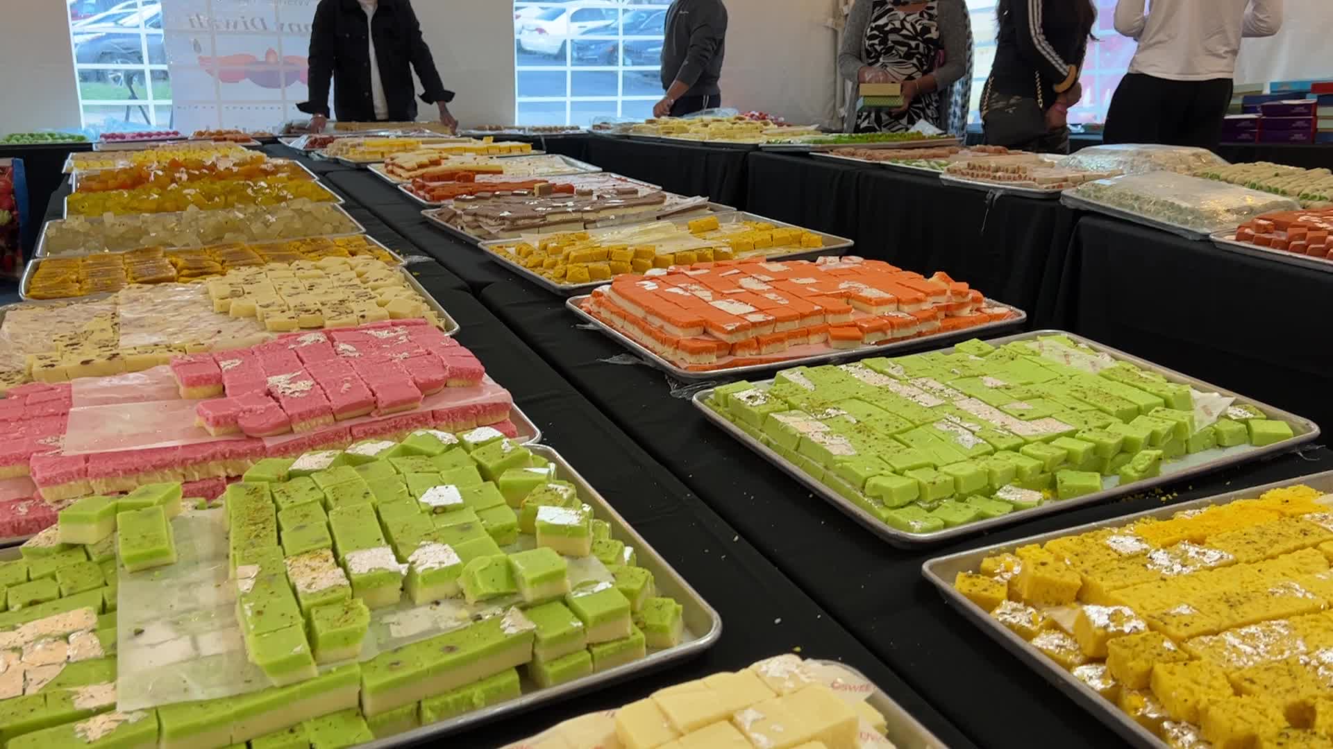 People purchase Indian sweets for the festival of Diwali 