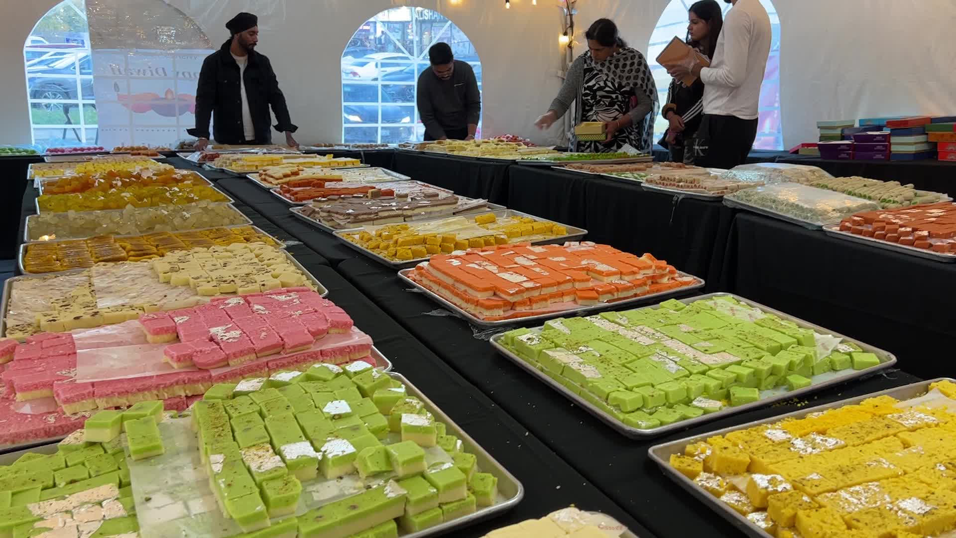 People purchase Indian sweets for the festival of Diwali 