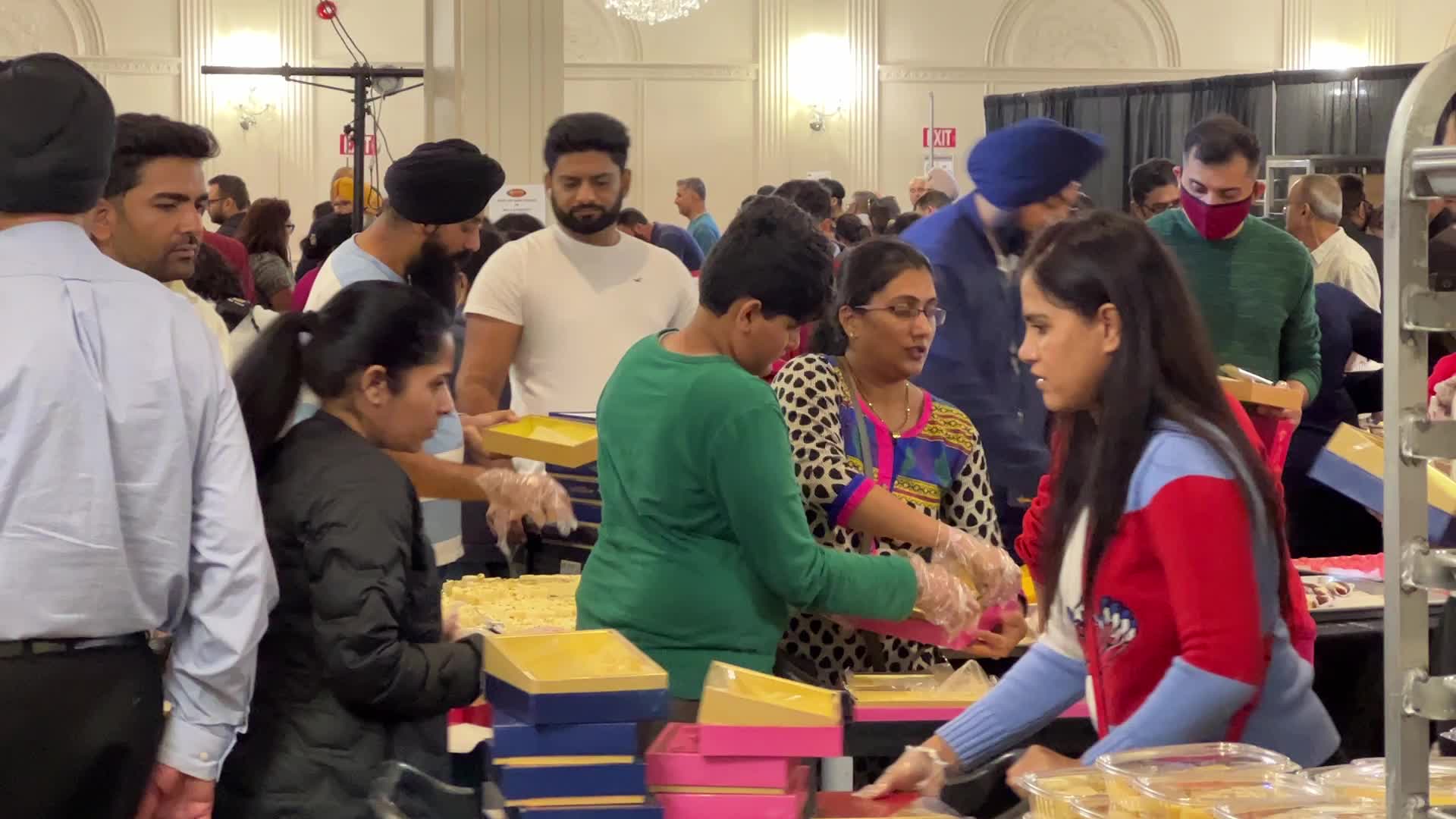 People purchase Indian sweets for the festival of Diwali 