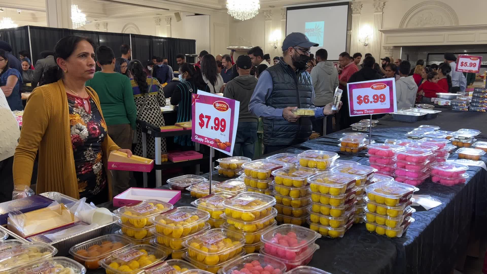 People purchase Indian sweets for the festival of Diwali 