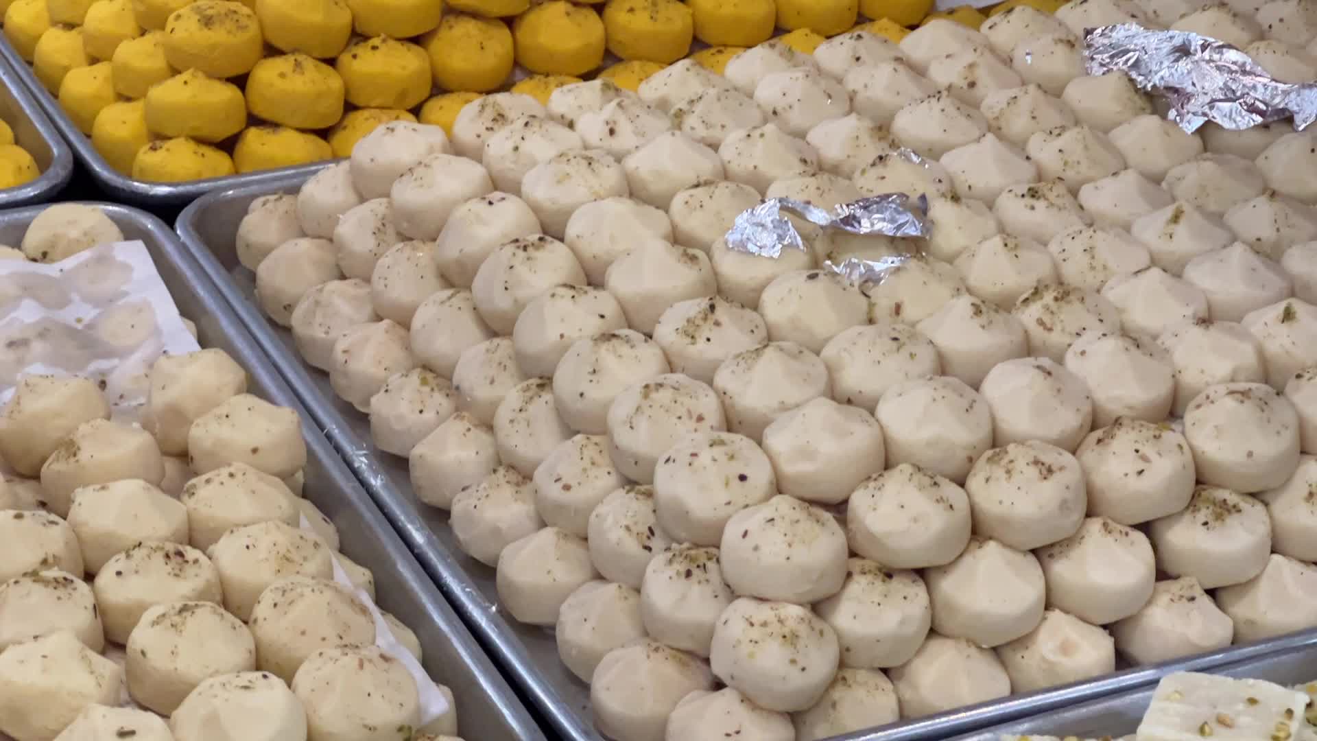 People purchase Indian sweets for the festival of Diwali 