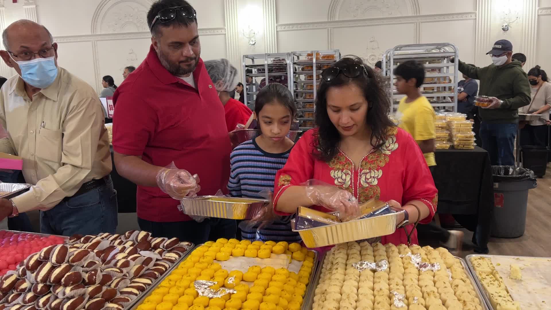 People purchase Indian sweets for the festival of Diwali 