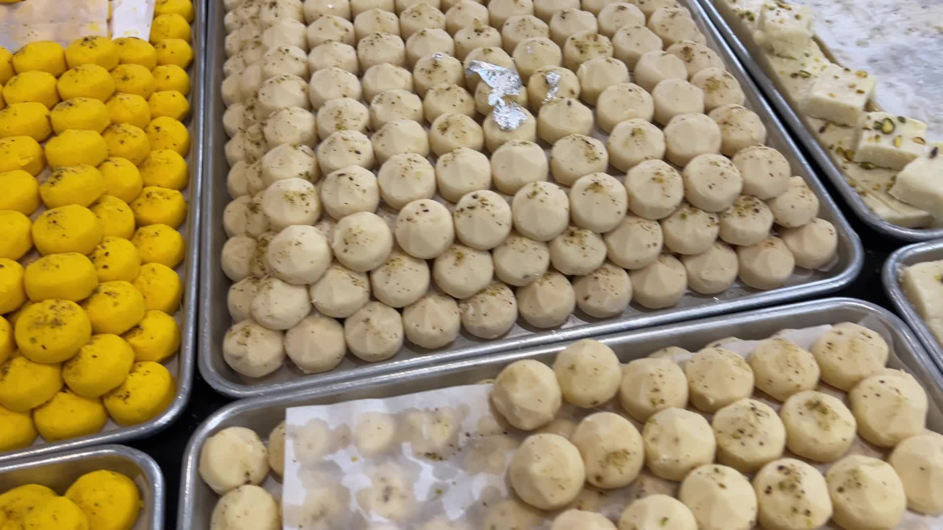 People purchase Indian sweets for the festival of Diwali 