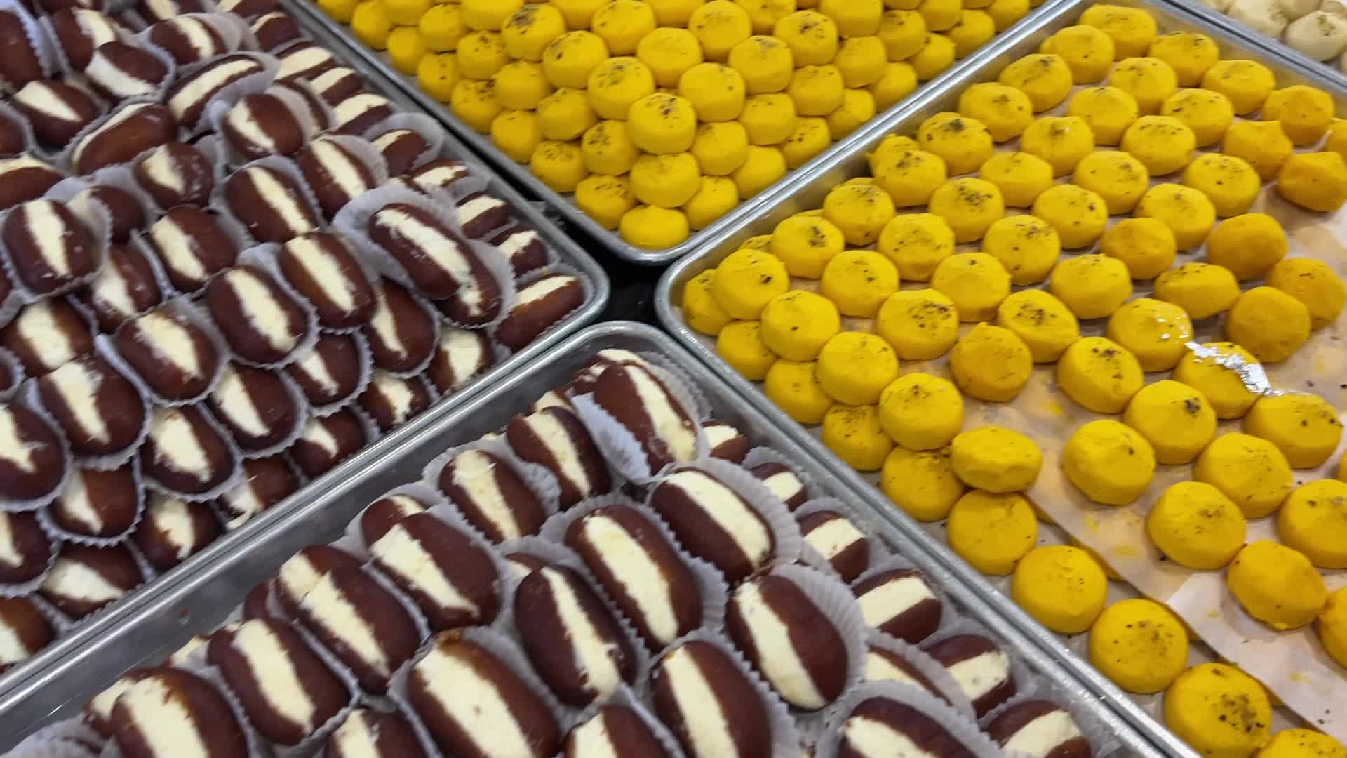 People purchase Indian sweets for the festival of Diwali 