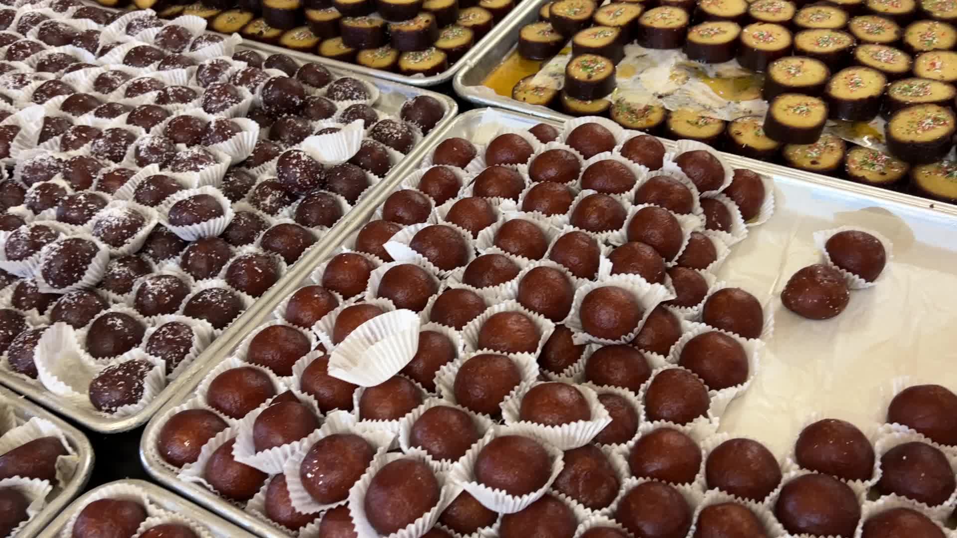People purchase Indian sweets for the festival of Diwali 
