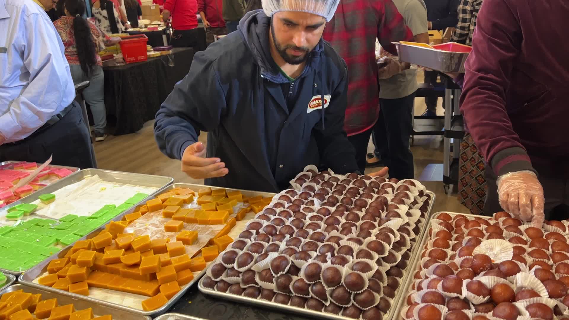 People purchase Indian sweets for the festival of Diwali 