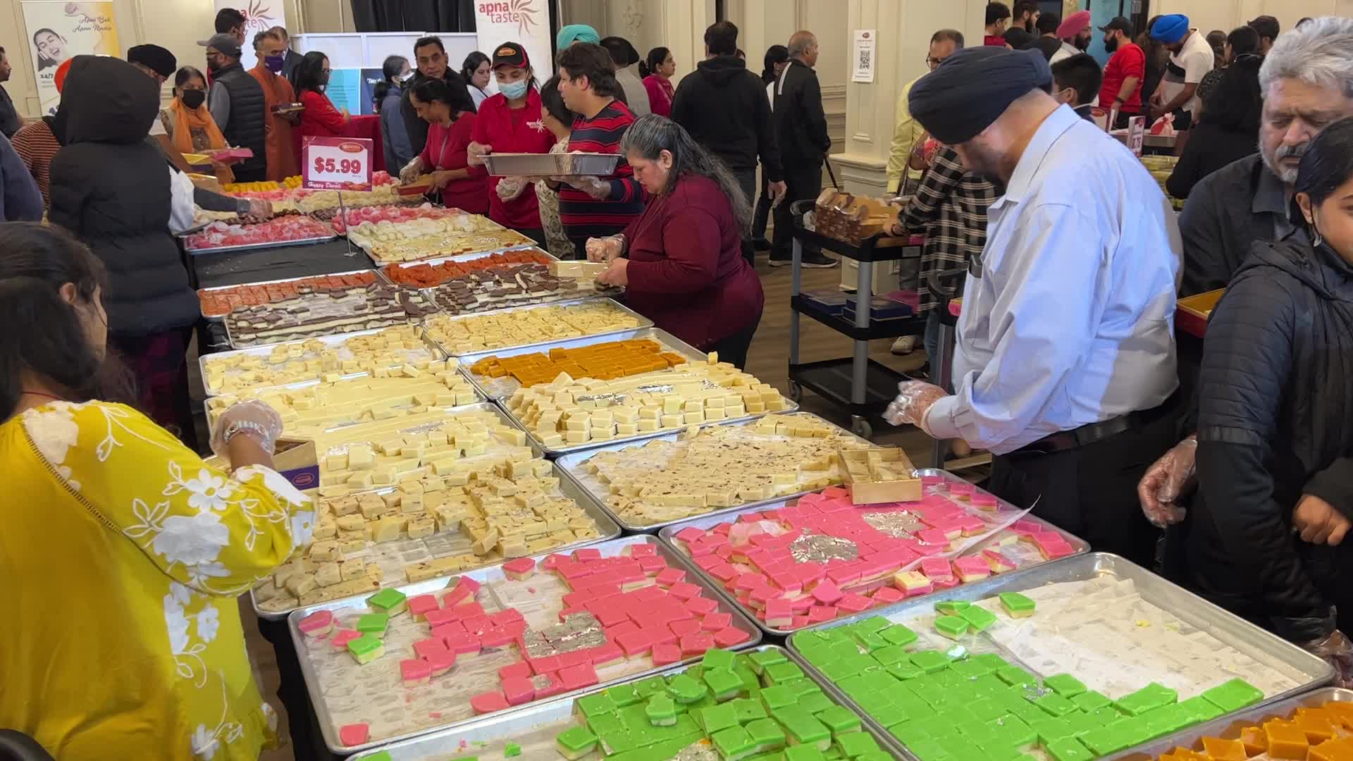 People purchase Indian sweets for the festival of Diwali 