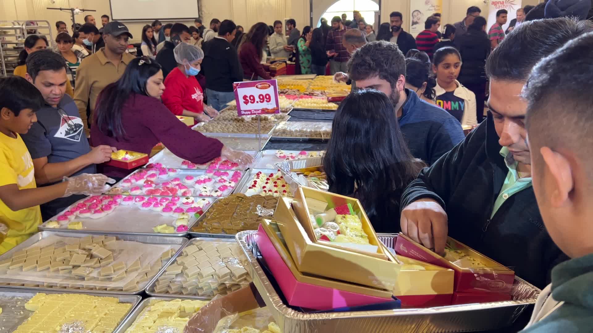 People purchase Indian sweets for the festival of Diwali 
