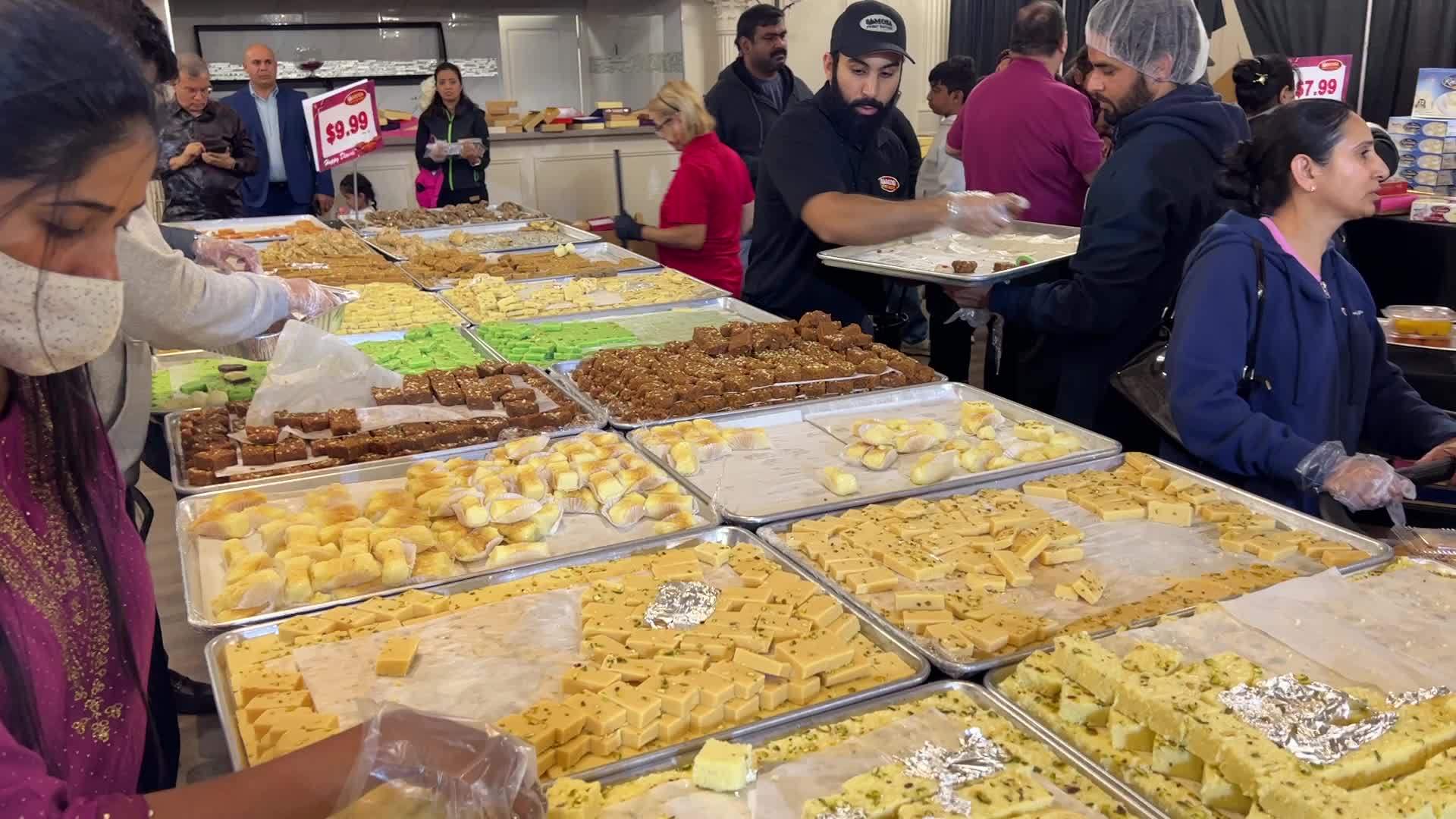 People purchase Indian sweets for the festival of Diwali 
