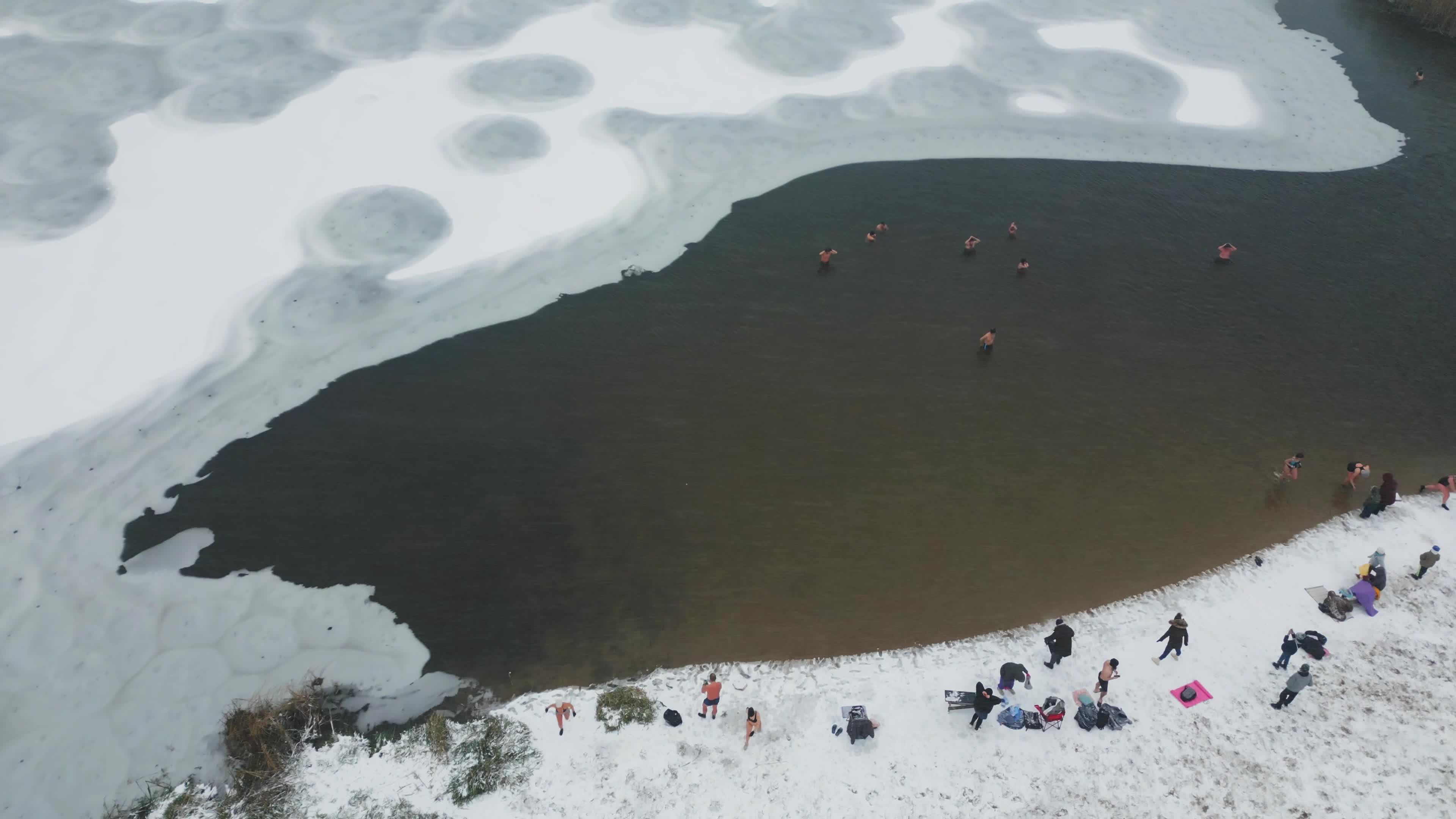Winter Swimmers in Warsaw During Snowstorm