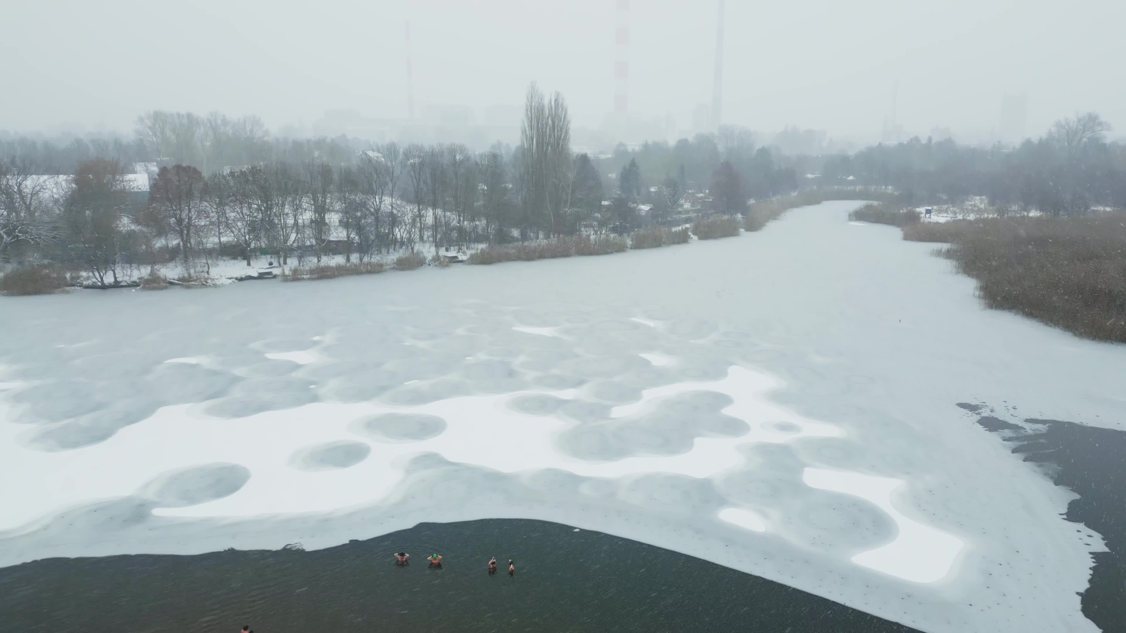 Winter Swimmers in Warsaw During Snowstorm