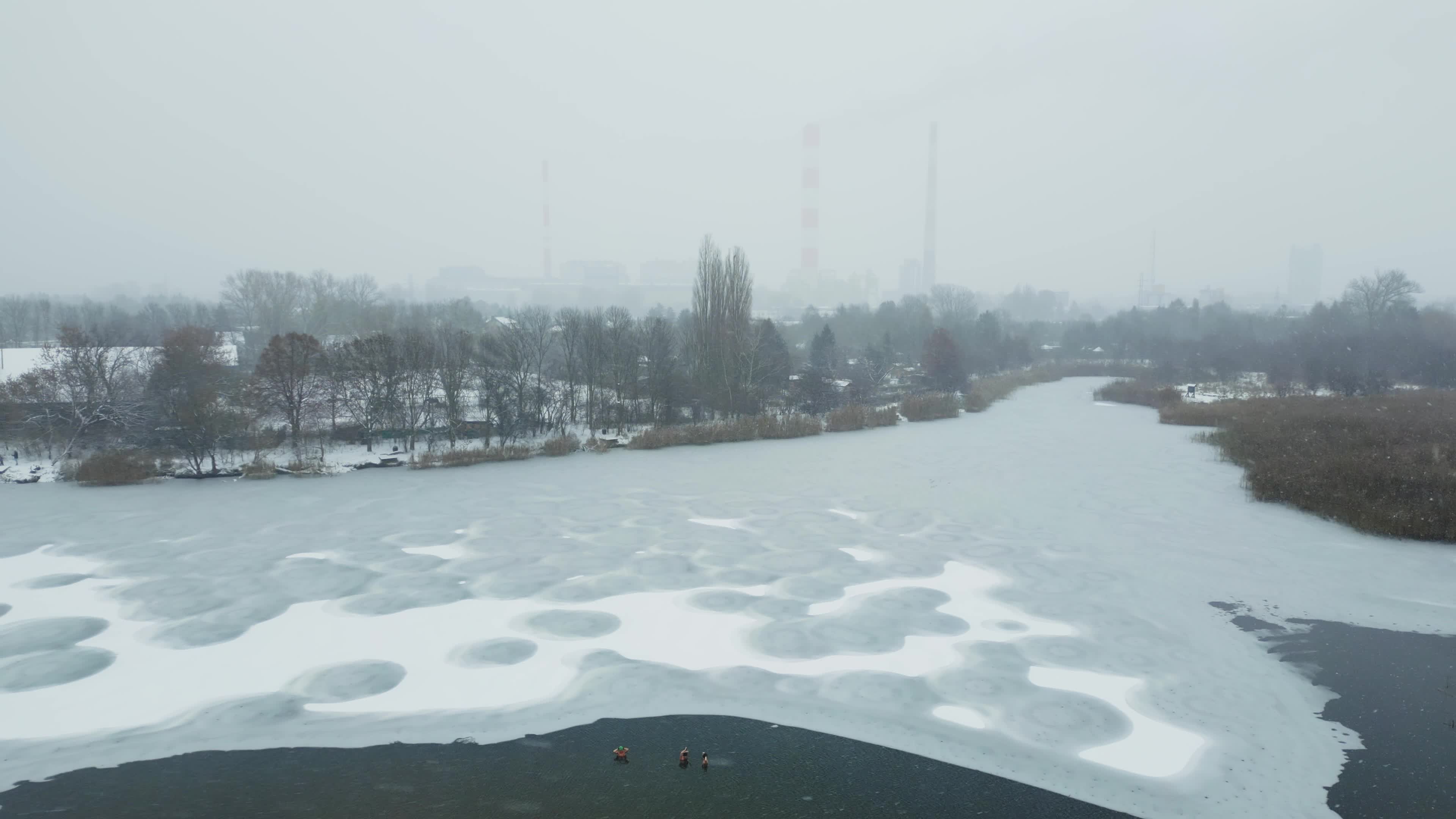 Winter Swimmers in Warsaw During Snowstorm