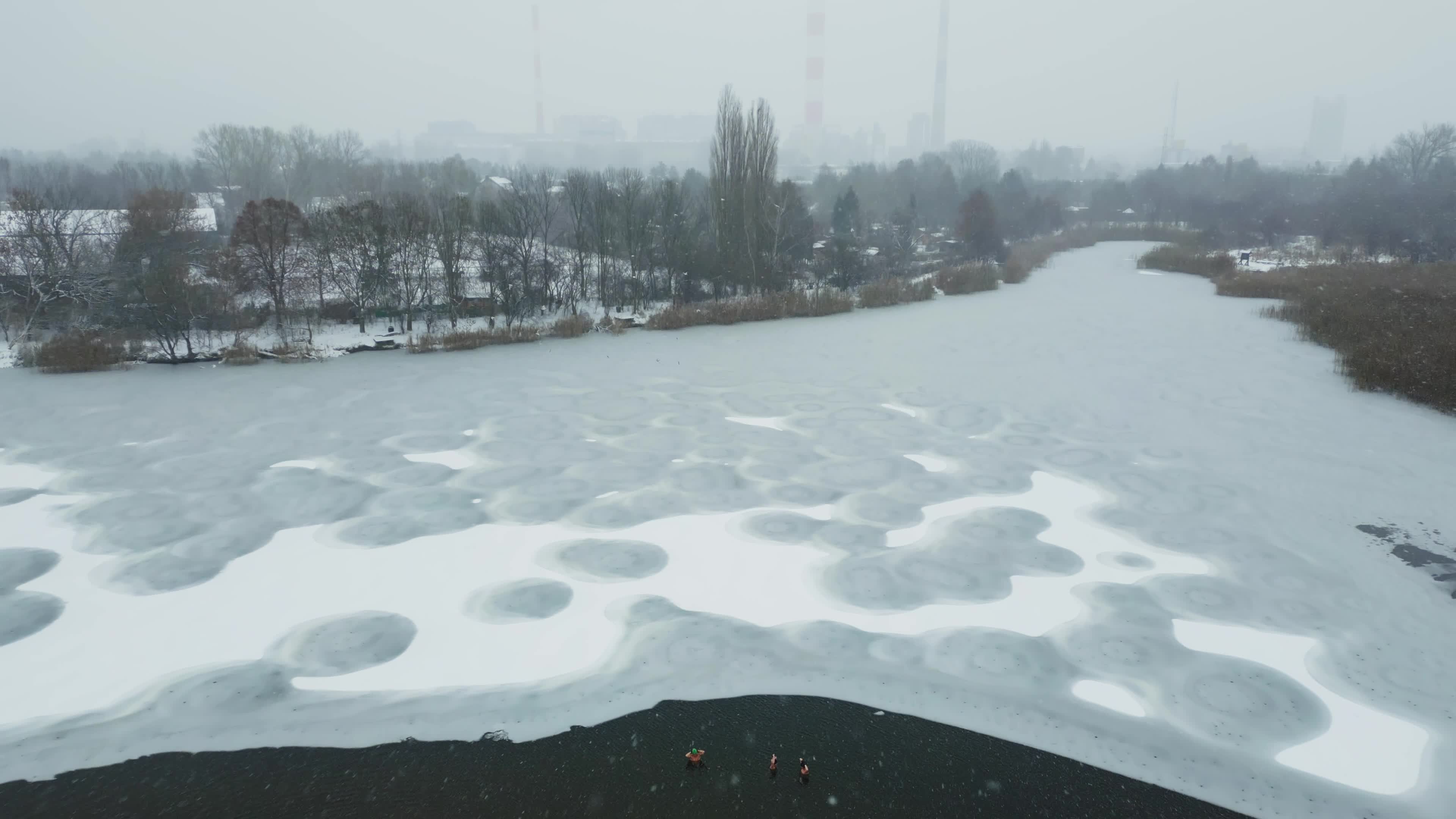 Winter Swimmers in Warsaw During Snowstorm