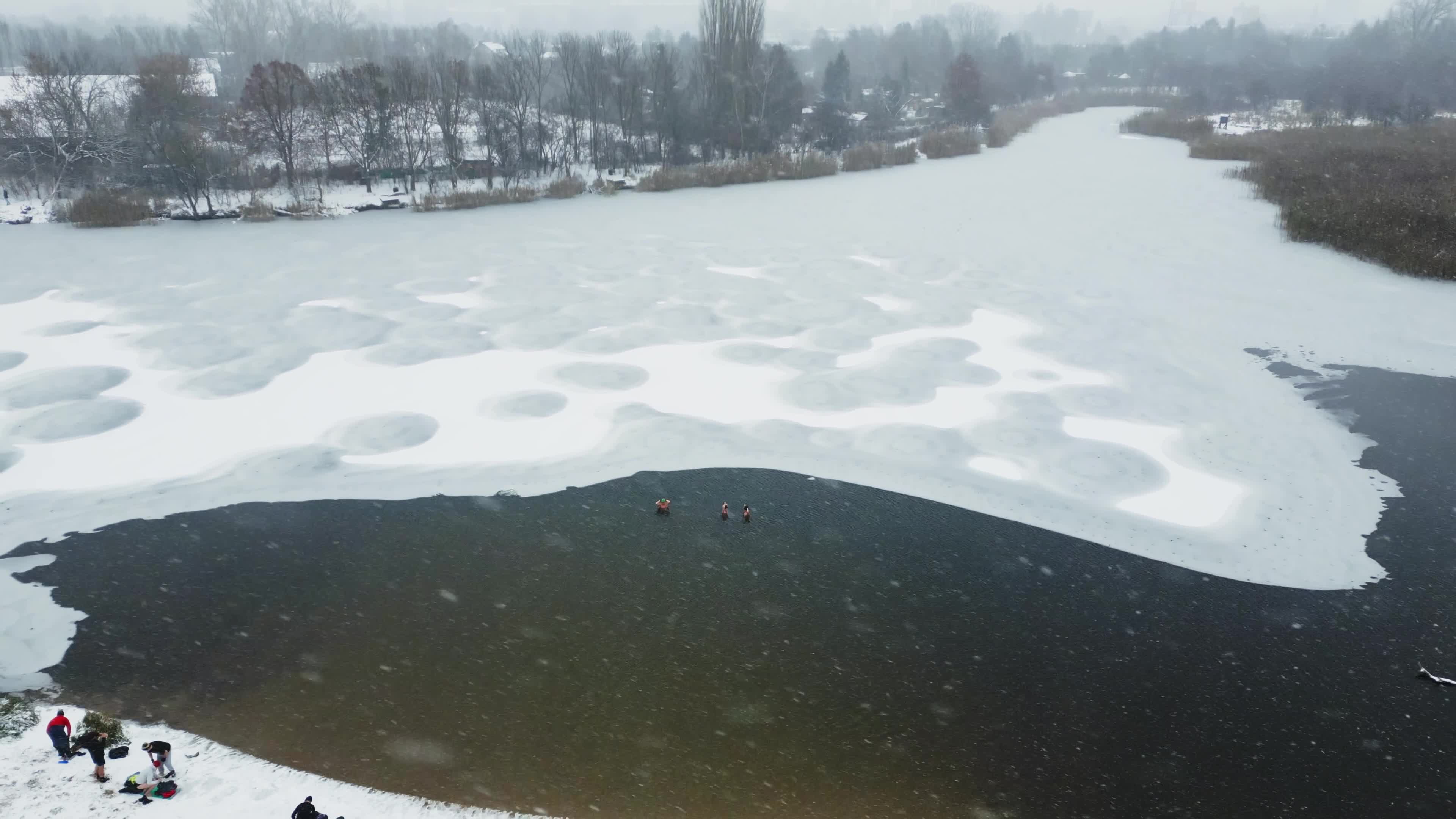 Winter Swimmers in Warsaw During Snowstorm