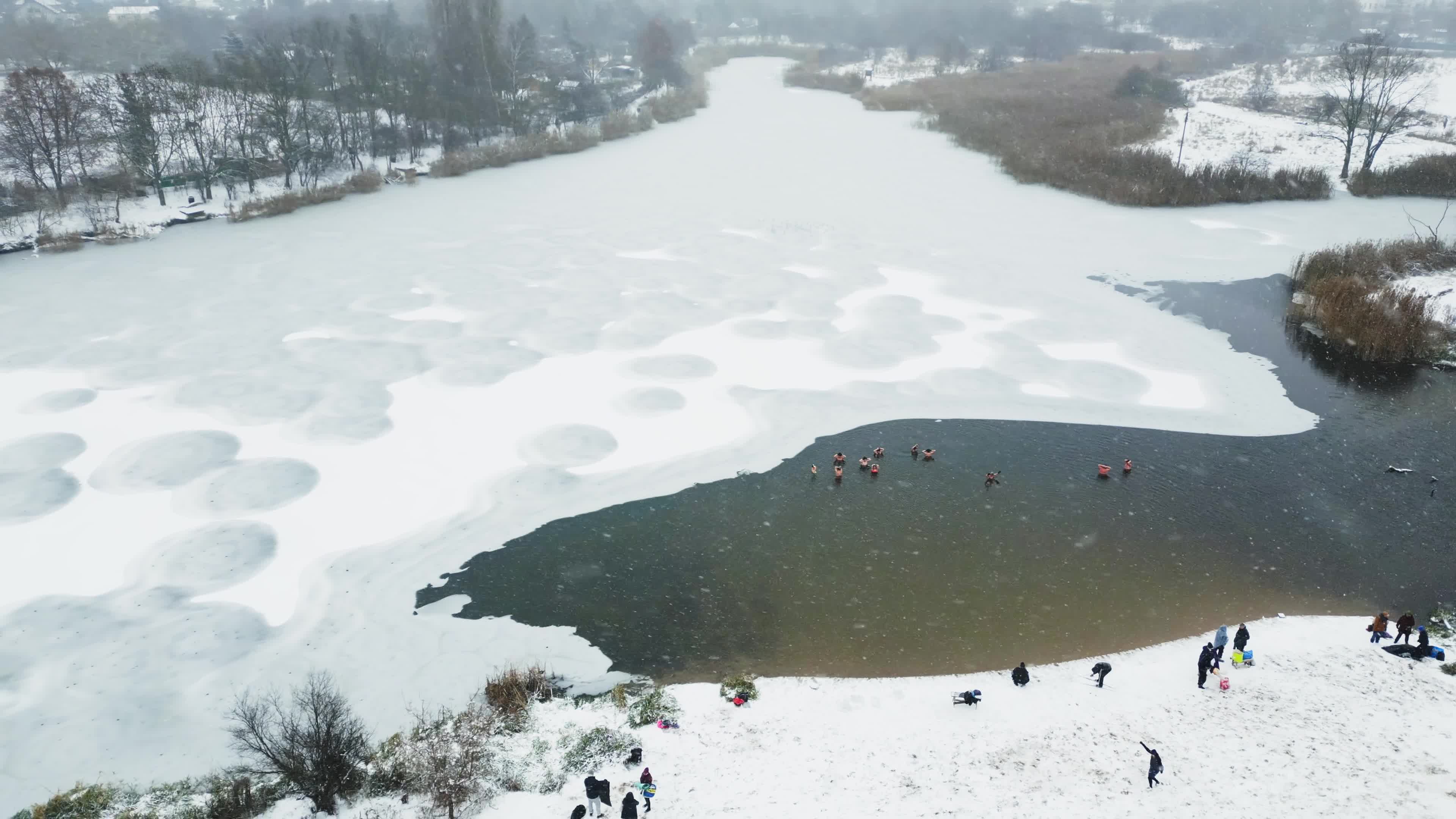 Winter Swimmers in Warsaw During Snowstorm