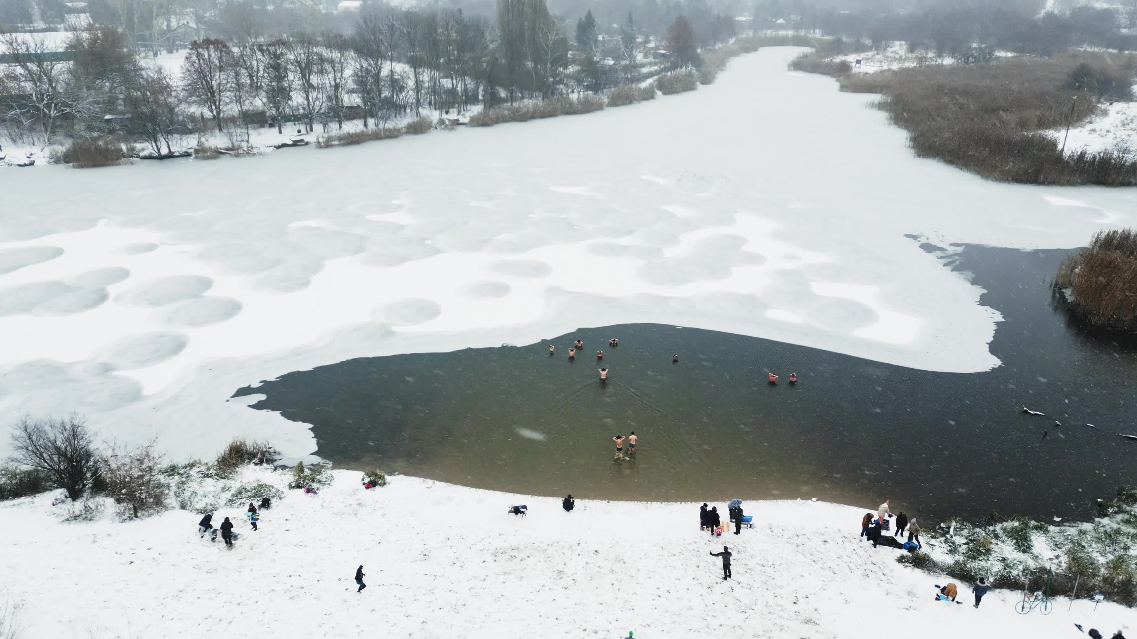 Winter Swimmers in Warsaw During Snowstorm