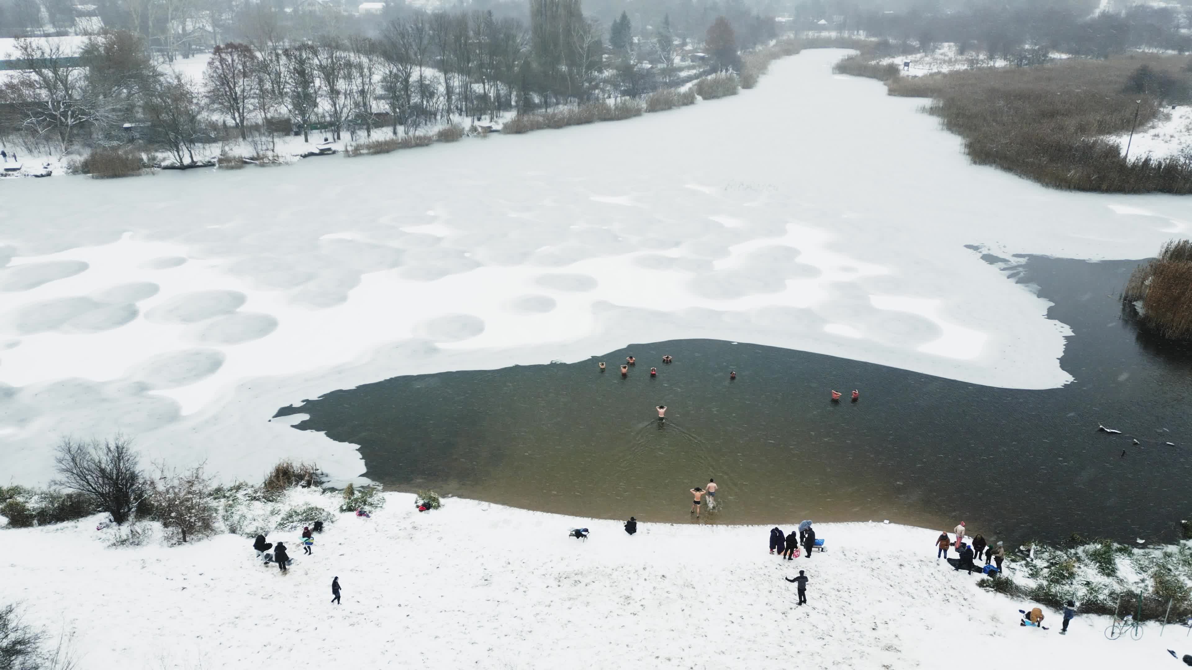 Winter Swimmers in Warsaw During Snowstorm