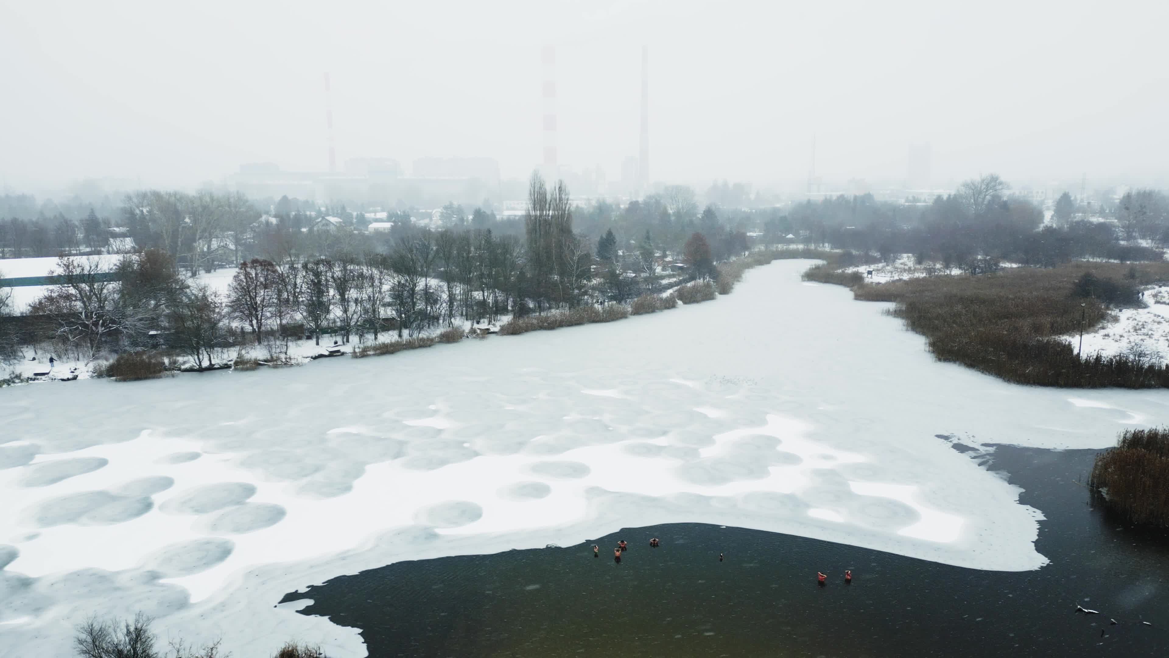 Winter Swimmers in Warsaw During Snowstorm