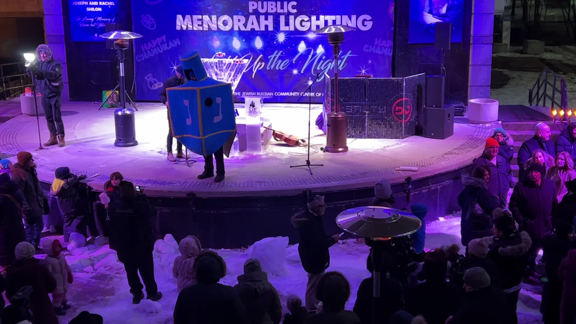 Jews celebrate Chanukah by lighting of a giant menorah made of ice