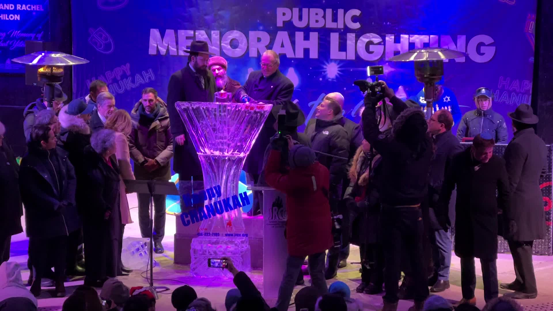 Jews celebrate Chanukah by lighting of a giant menorah made of ice
