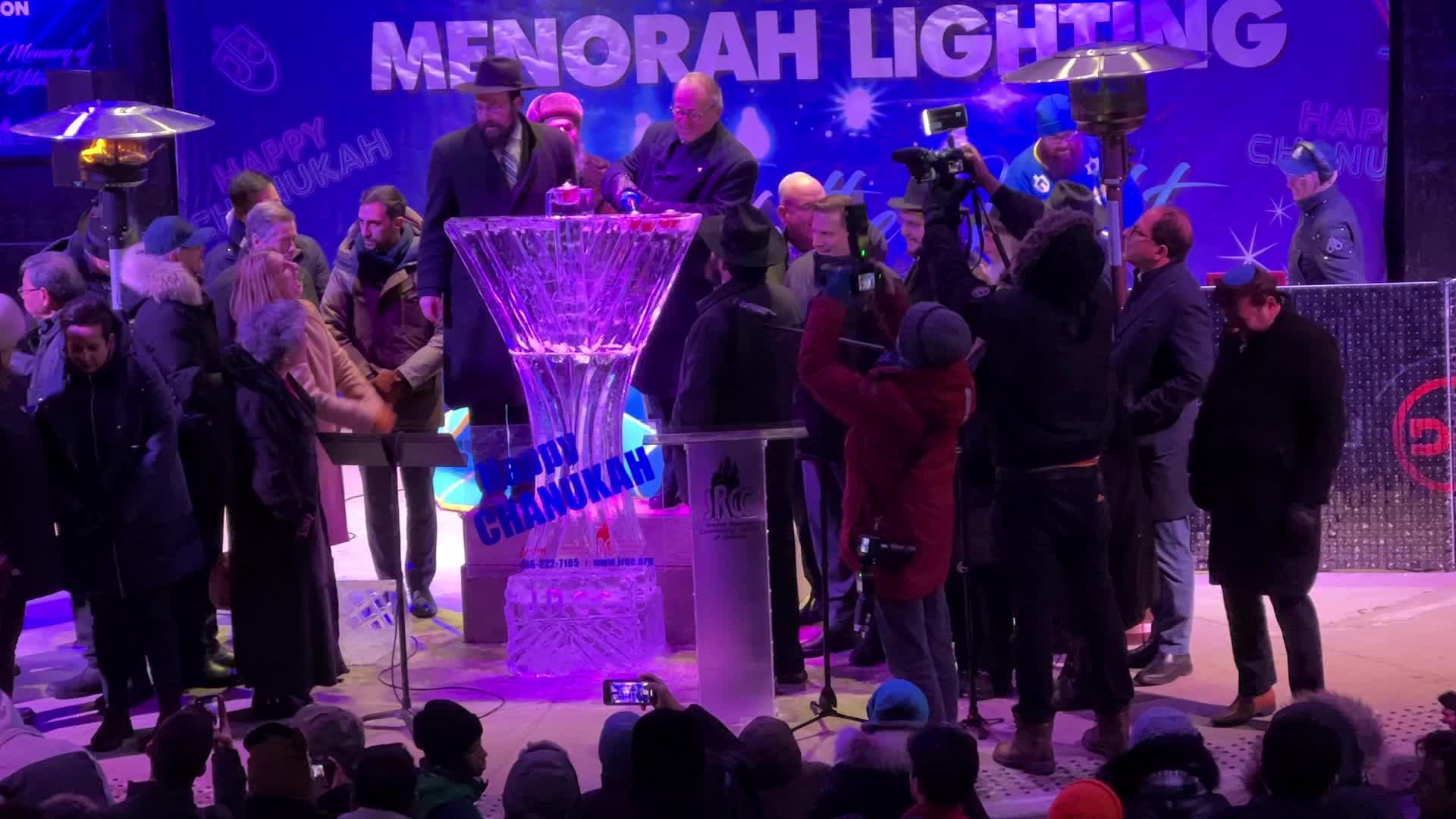 Jews celebrate Chanukah by lighting of a giant menorah made of ice
