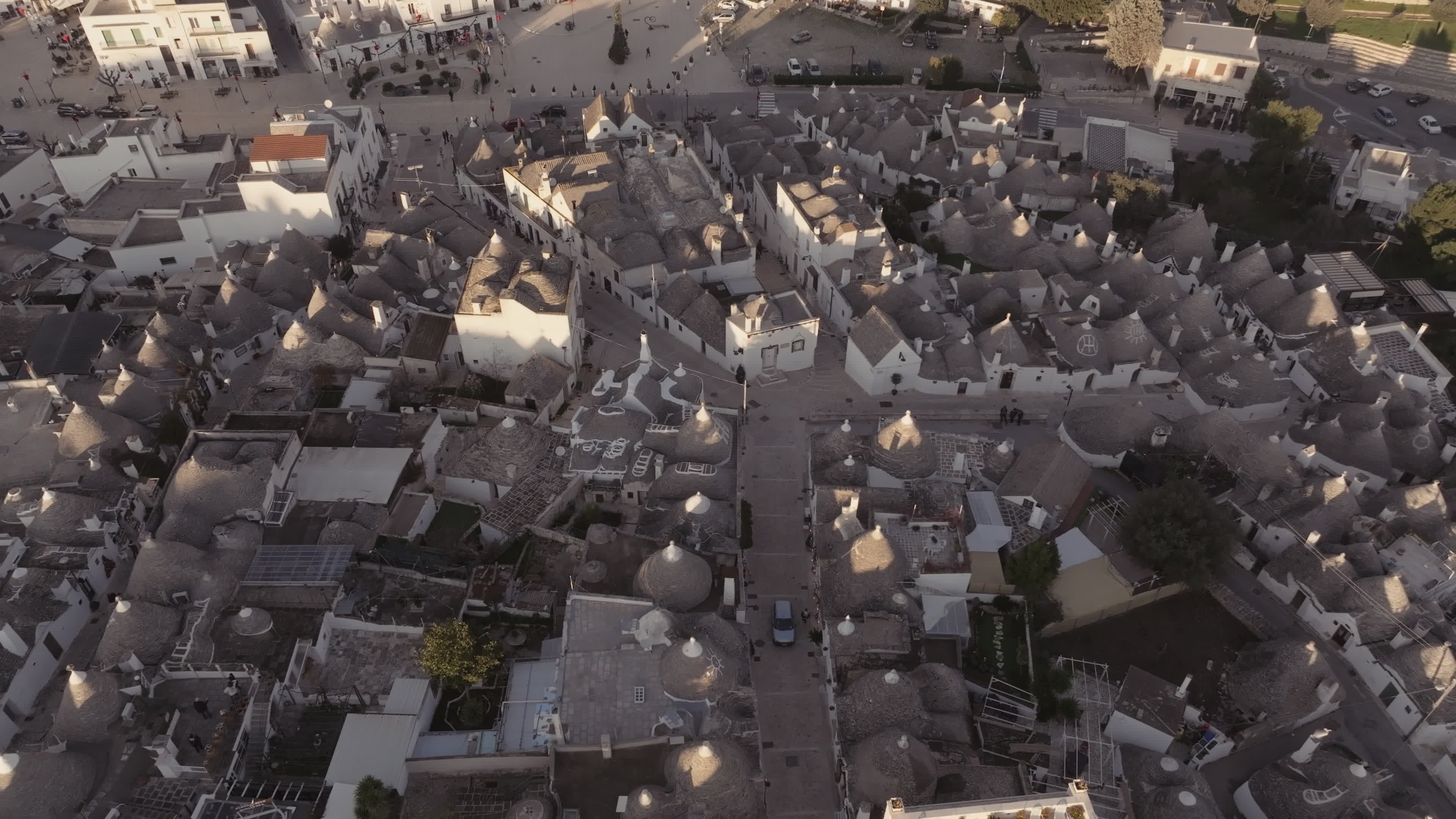 Drone View Of UNESCO World Heritage-listed Trulli Of Alberobello At Sunset
