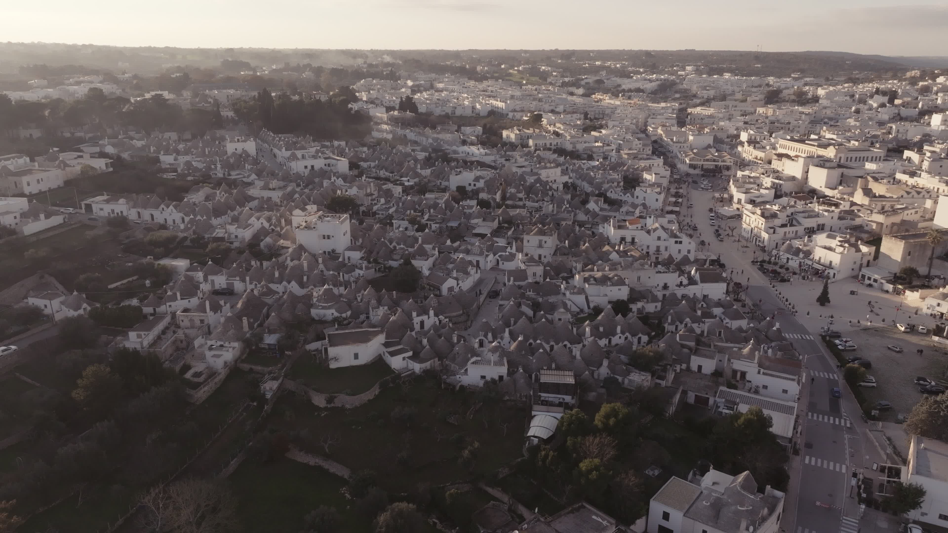 Drone View Of UNESCO World Heritage-listed Trulli Of Alberobello At Sunset