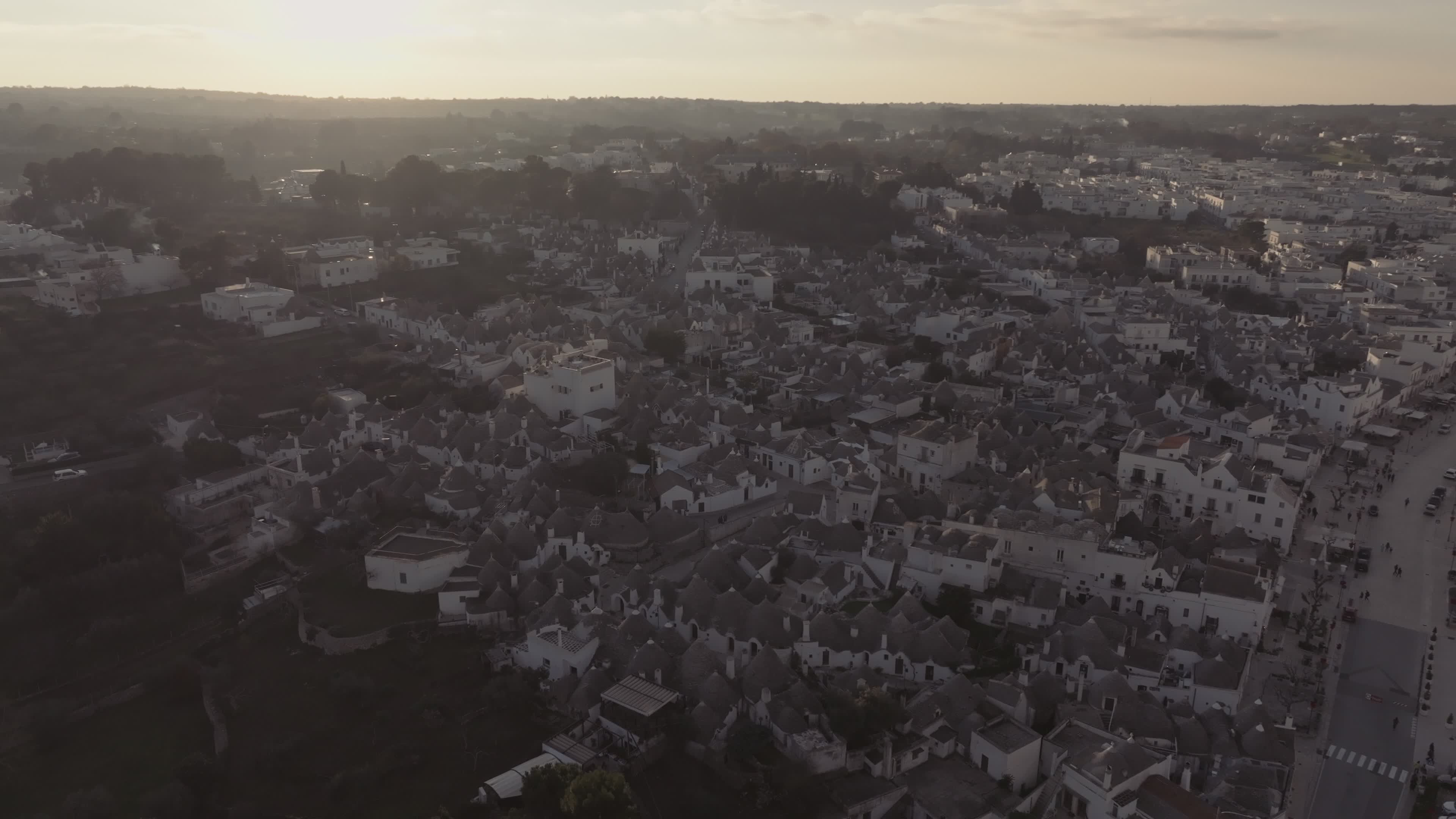 Drone View Of UNESCO World Heritage-listed Trulli Of Alberobello At Sunset